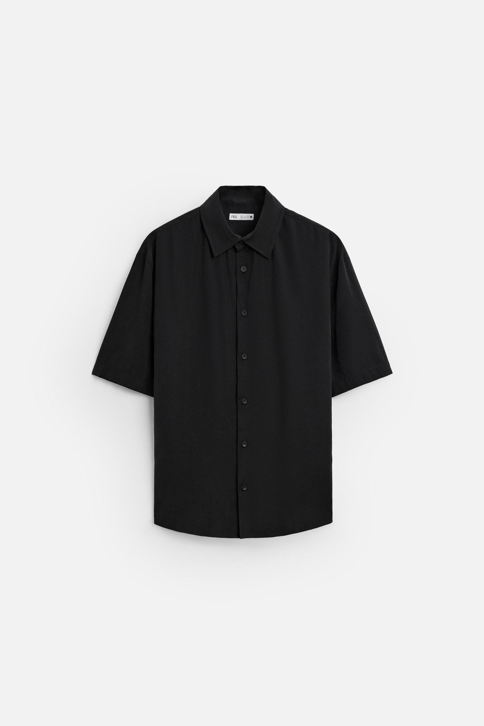 Relaxed fit shirt made of modal blend fabric. Lapel collar and short sleeves. Front button closure. Product Image