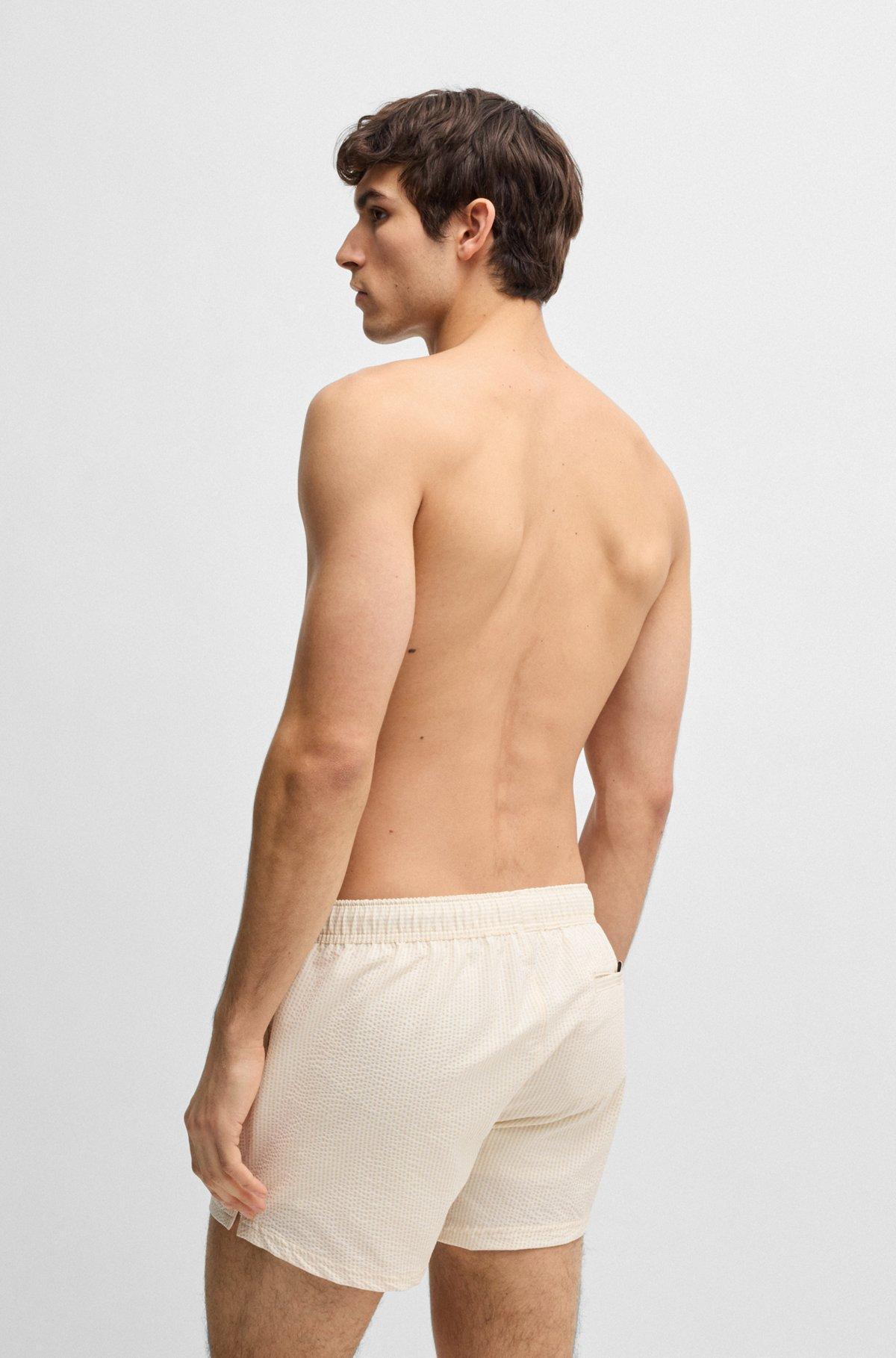 Swim shorts in striped seersucker fabric Product Image