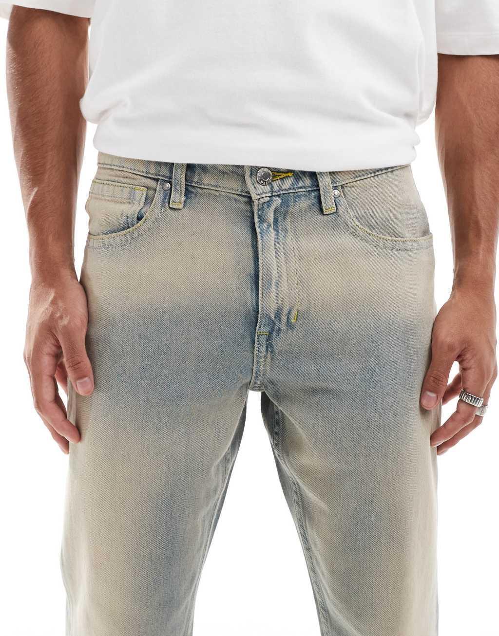 ASOS DESIGN tapered jeans in light wash with tint Product Image