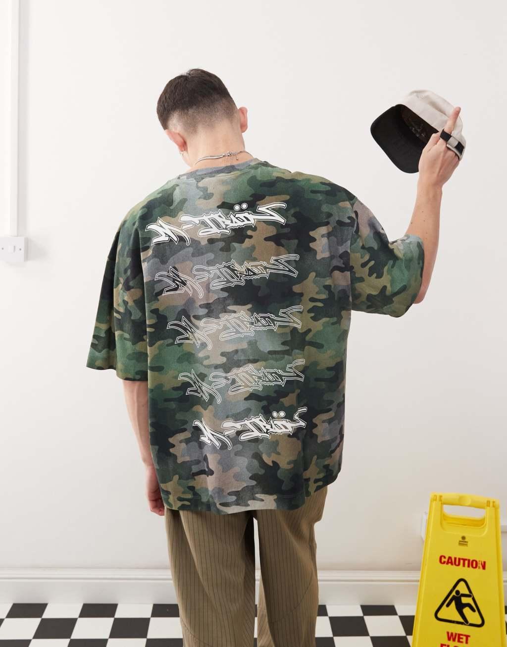 COLLUSION relaxed graffiti graphic t-shirt in camo print Product Image
