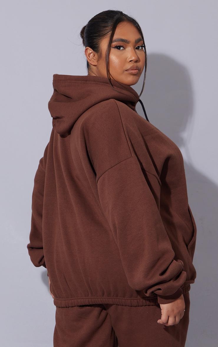 PRETTYLITTLETHING Plus Chocolate Oversized Fit Graphic Printed Hoodie Product Image