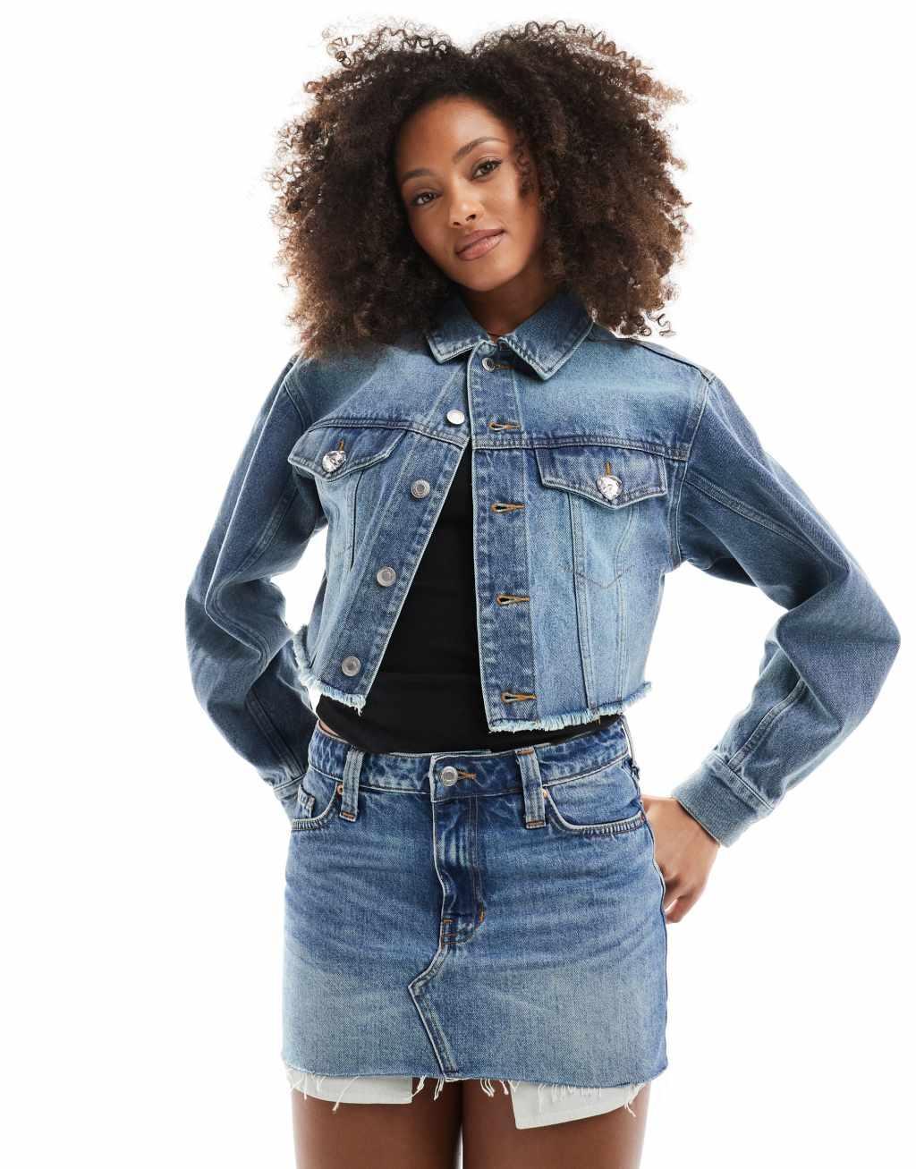 Monki low waist denim mini skirt in mid blue wash  Product Image