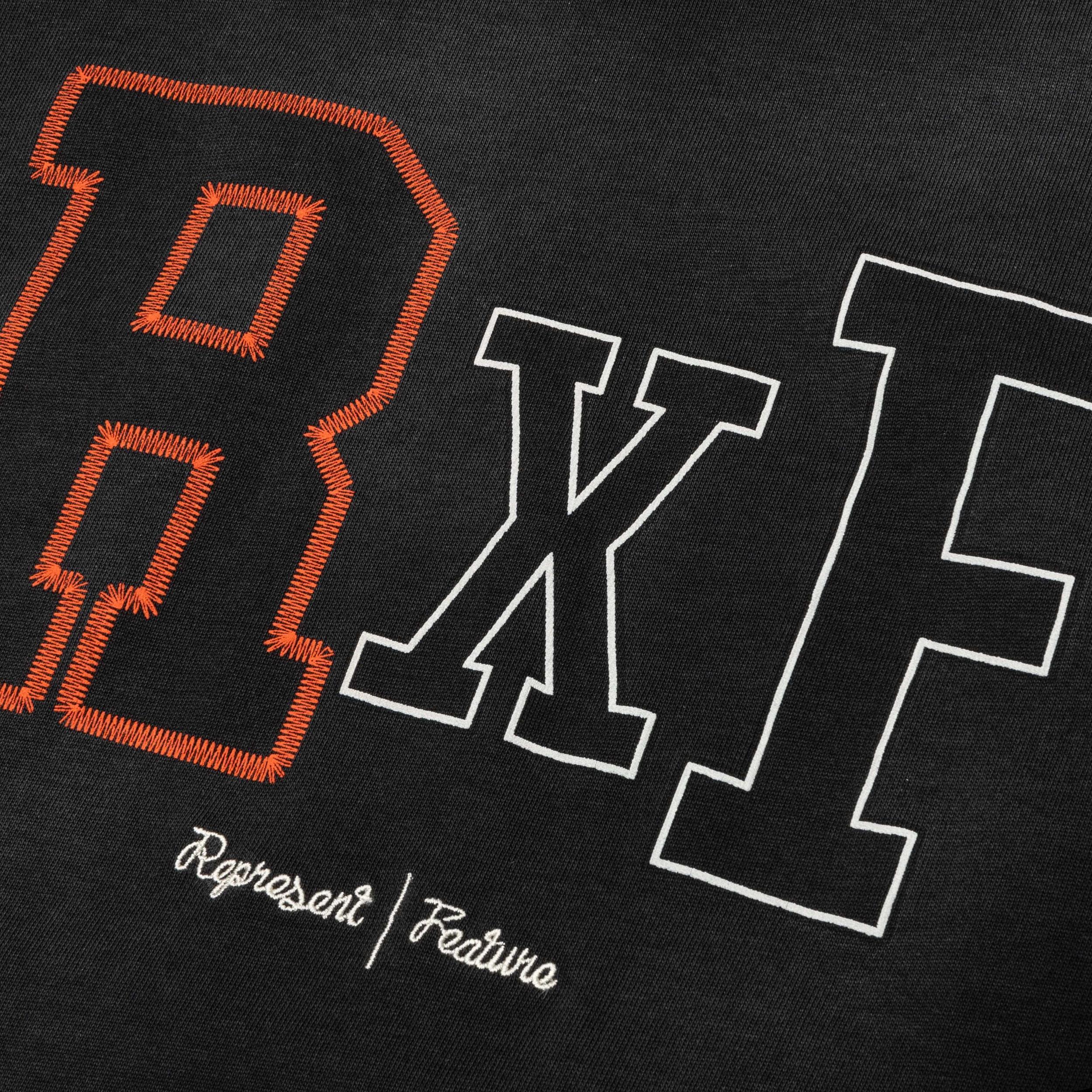 Feature x Represent Champions T-Shirt - Stained Black Male Product Image