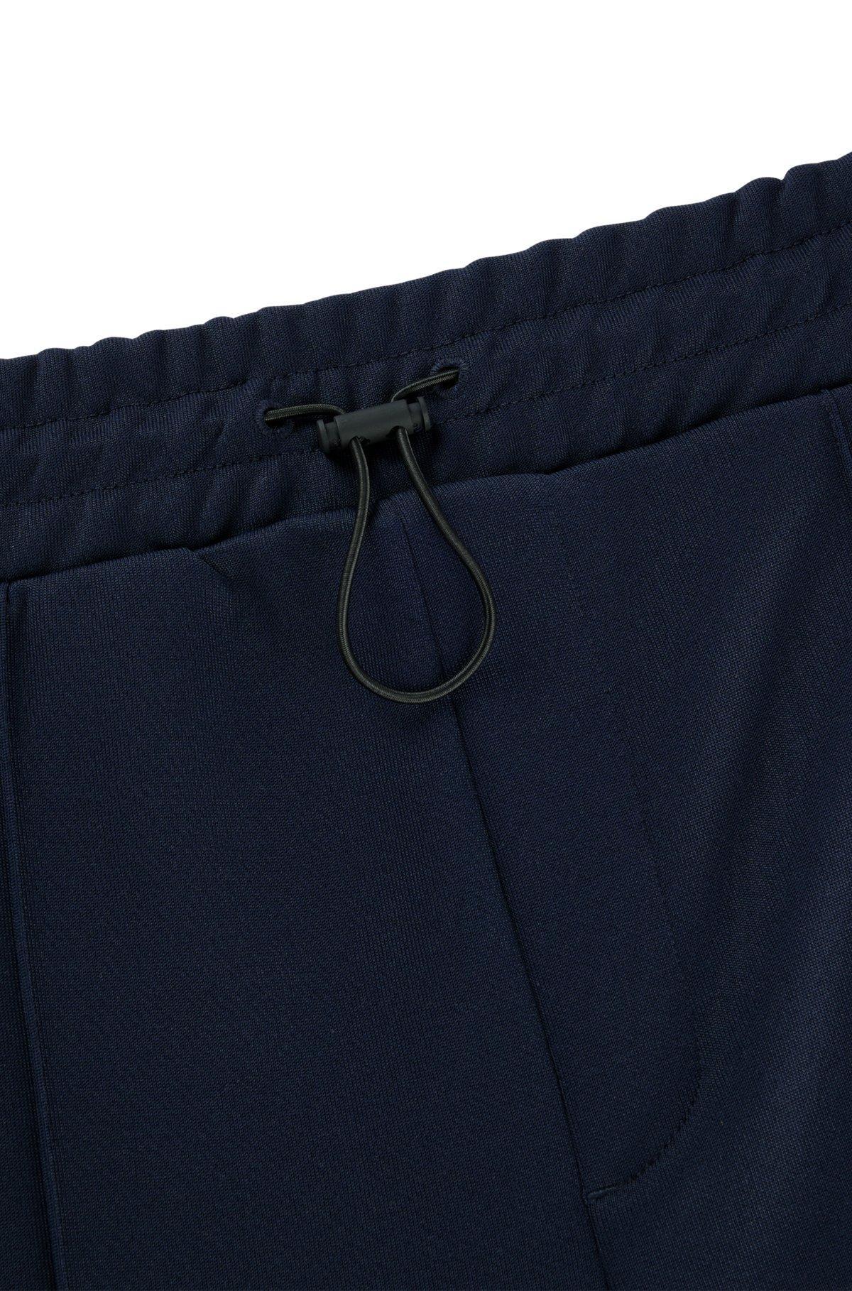 Relaxed-fit tracksuit bottoms with color-blocking Product Image