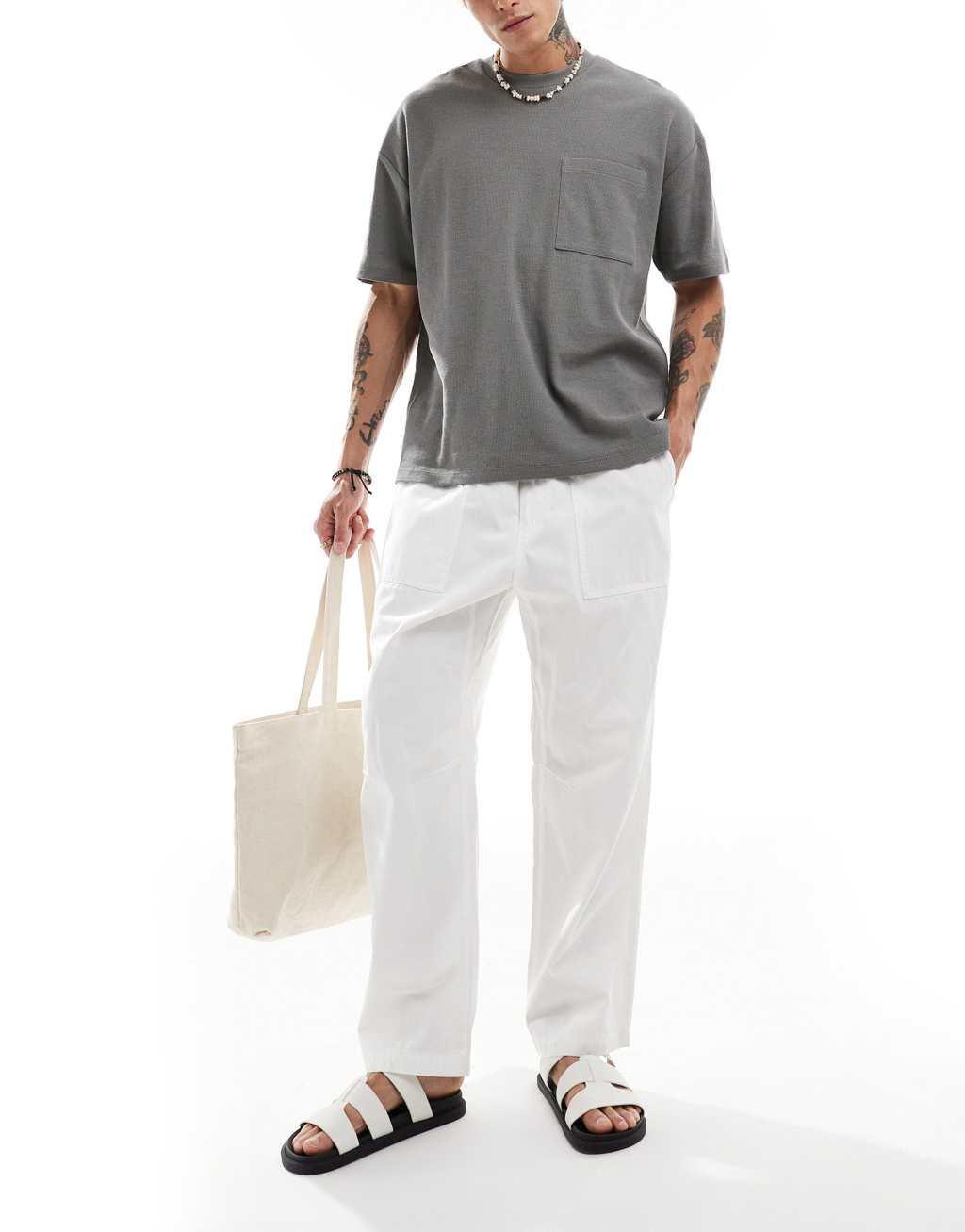 ASOS DESIGN oversized textured t-shirt with front pocket in charcoal Product Image