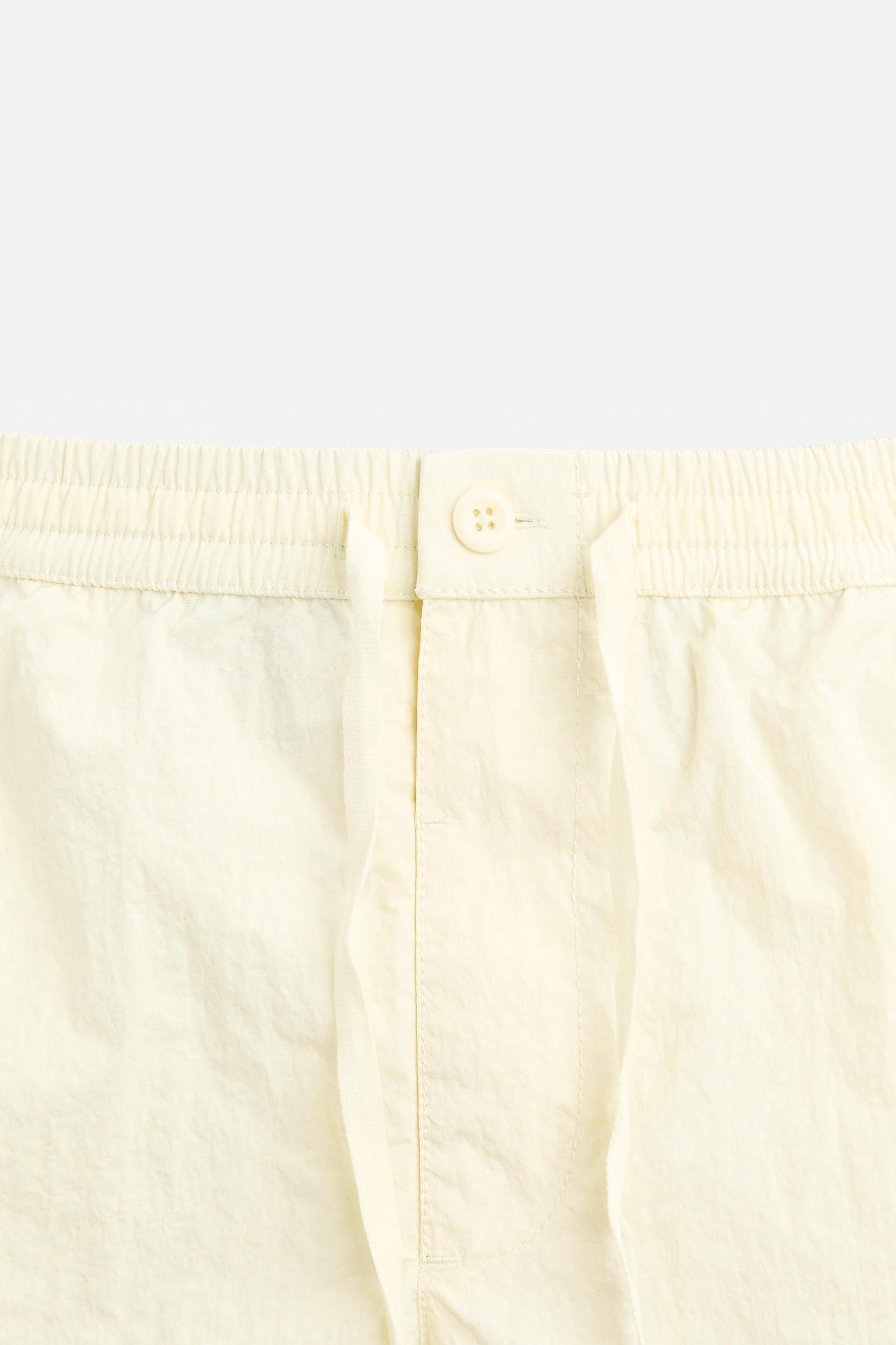 BUTTON SHORT SWIMMING TRUNKS Product Image