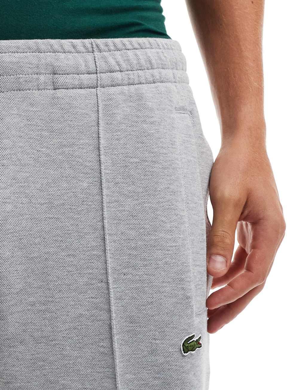 Lacoste logo sweatpants in gray Product Image