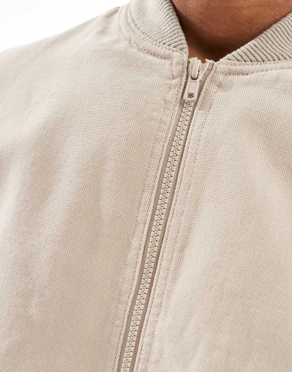 ASOS DESIGN washed bomber jacket in beige Product Image