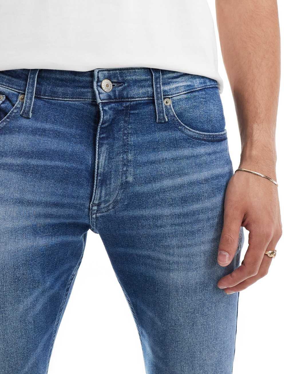Tommy Jeans Scanton slim ripped jeans in mid wash Product Image