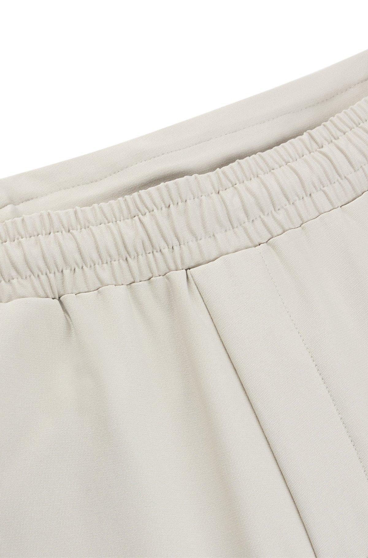Tracksuit bottoms in stretch fabric with decorative reflective logo Product Image