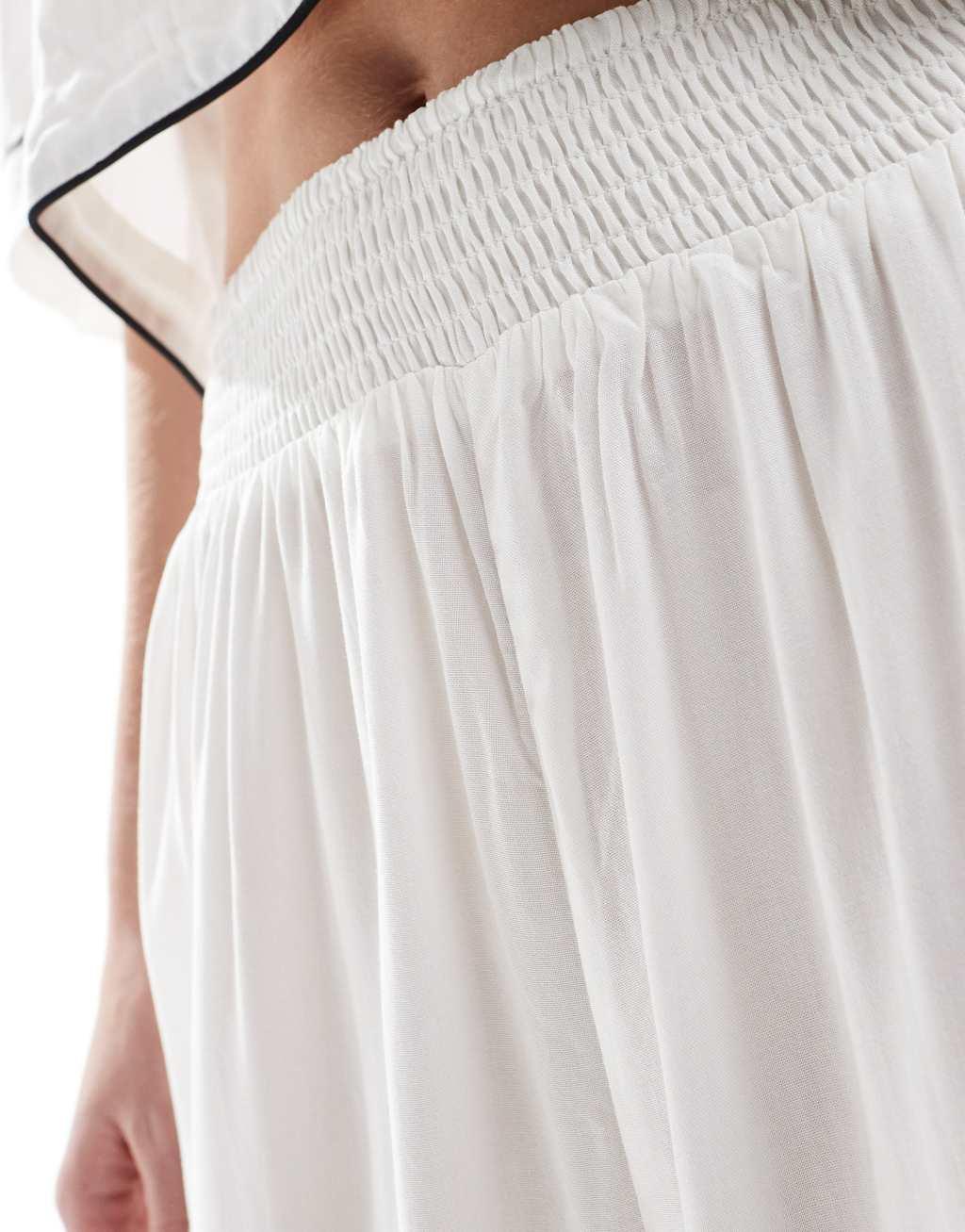 ASOS DESIGN Tall super soft slinky wide leg pajama pants in white with contrast binding Product Image