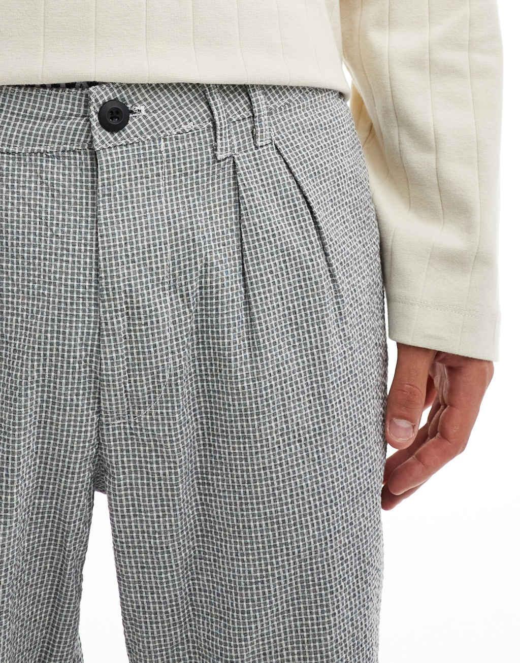ASOS DESIGN tapered pleated pants in black and white textured micro plaid Product Image