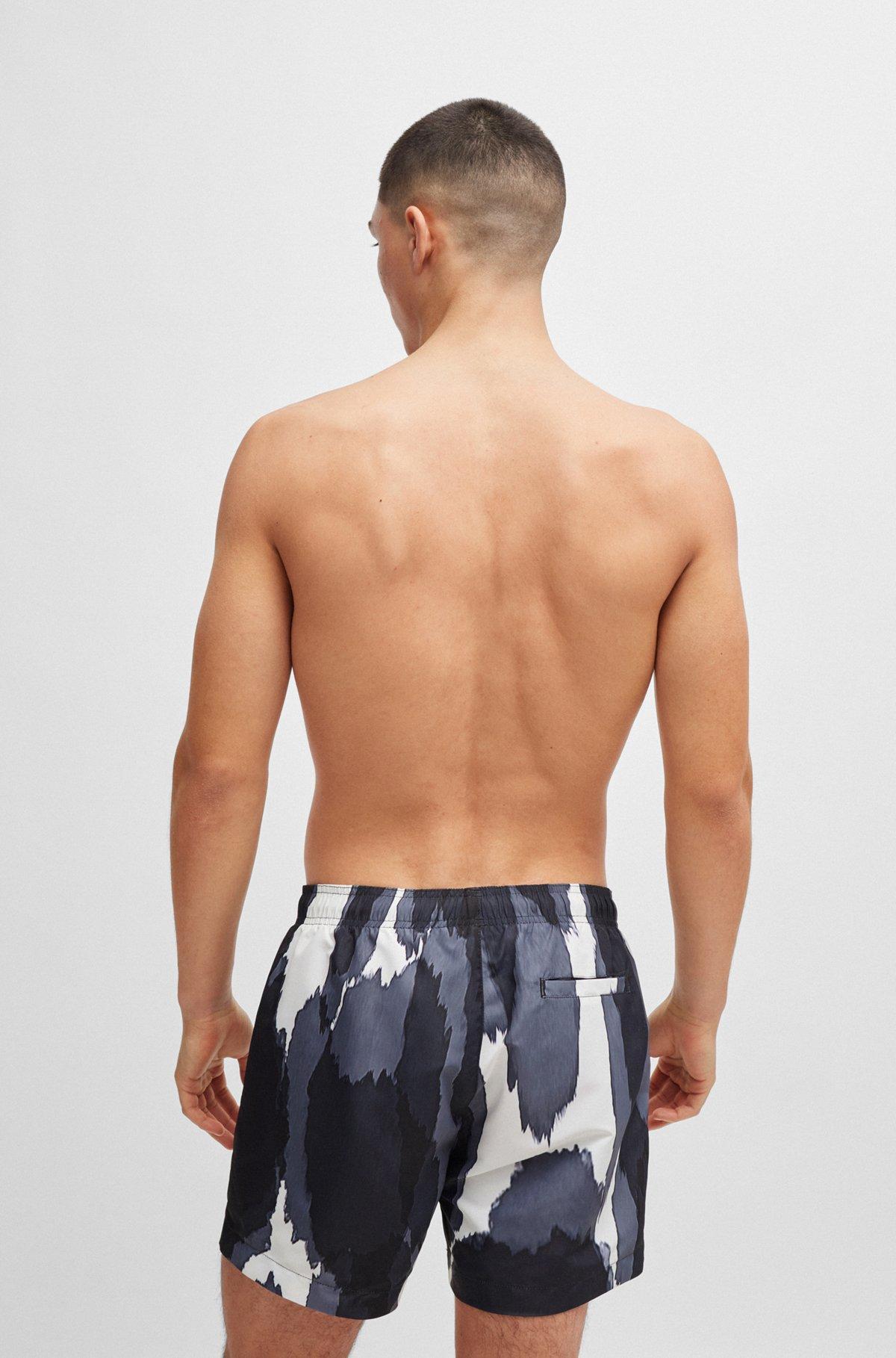 Seasonal-print quick-dry swim shorts with metallic logo Product Image