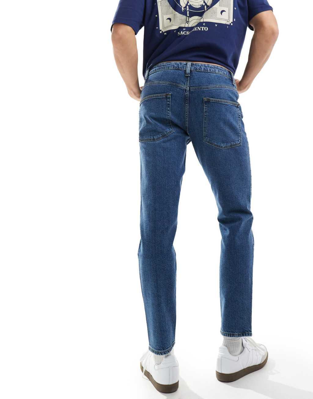 ASOS DESIGN stretch tapered jeans in dark wash blue Product Image