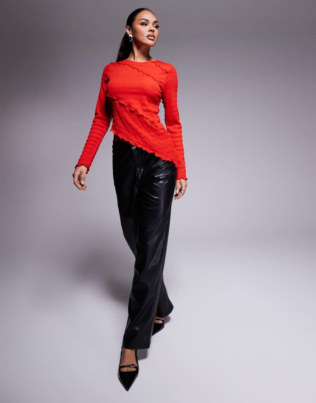 ASOS DESIGN long sleeve crinkle textured top with asymmetric hem in red Product Image