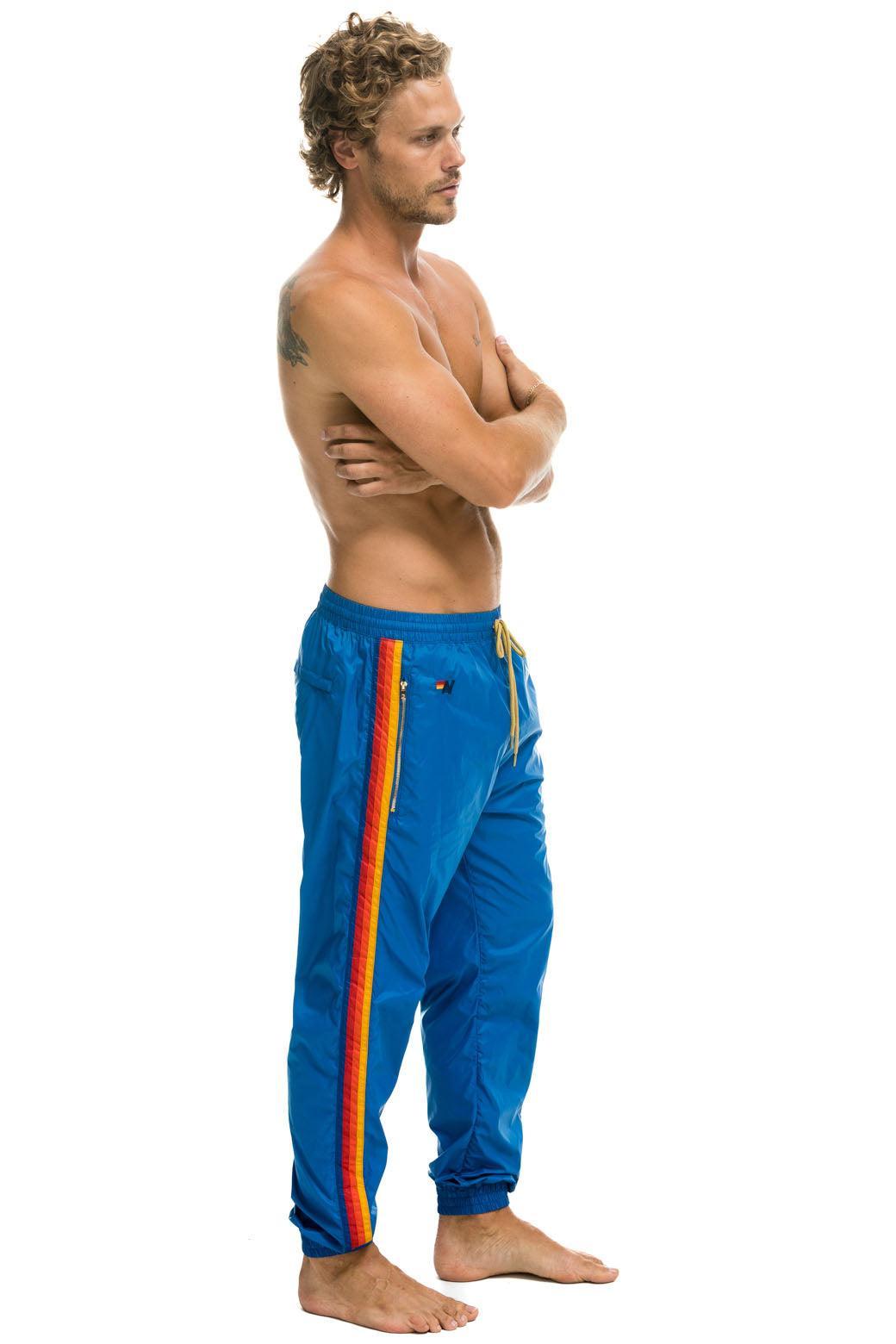 MEN'S 4 STRIPE WIND PANT - SNORKEL BLUE Male Product Image