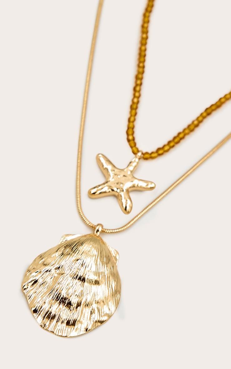 Gold Star And Shell Layered Necklace Product Image