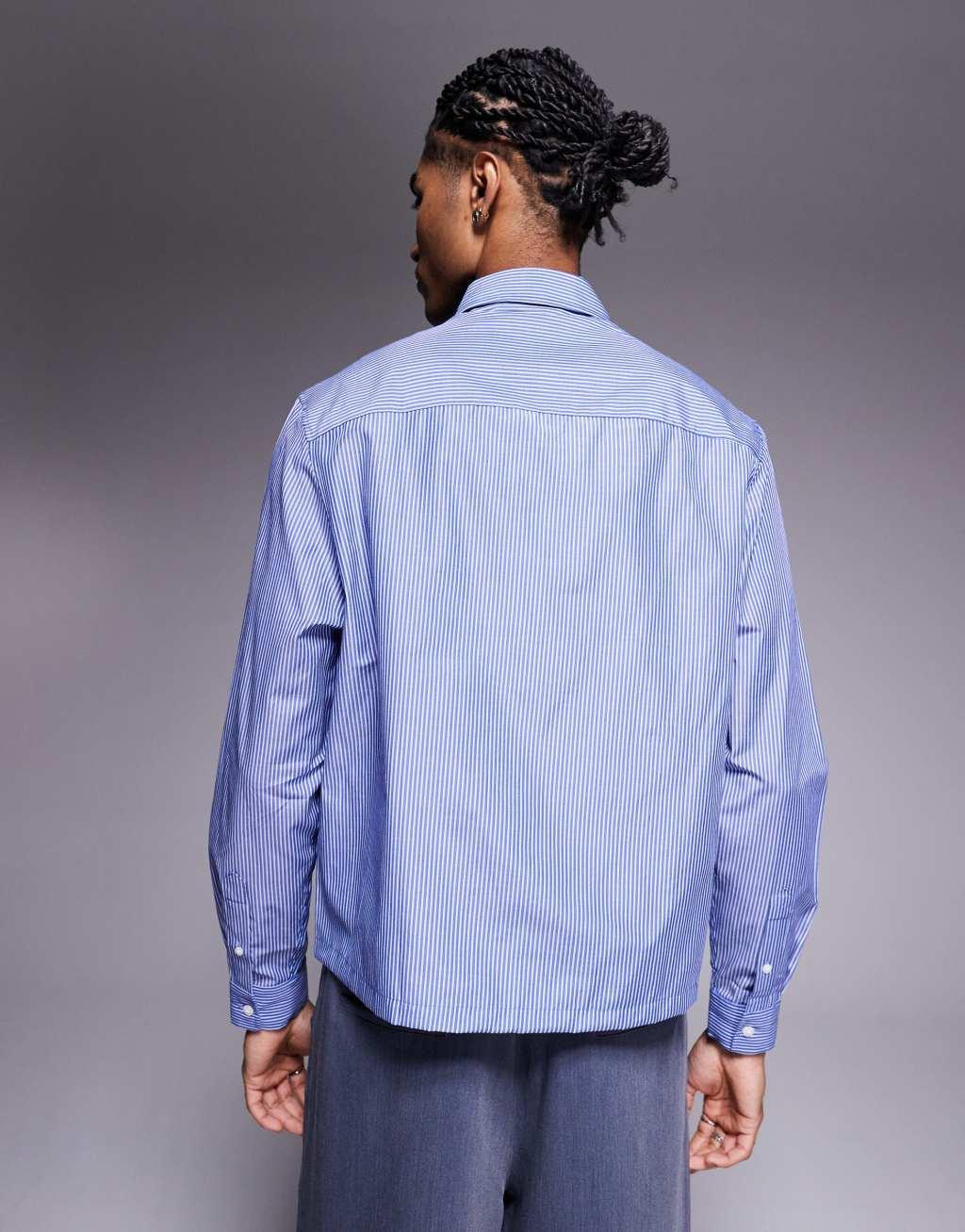 ASOS DESIGN boxy relaxed striped shirt with chest embroidery in blue Product Image