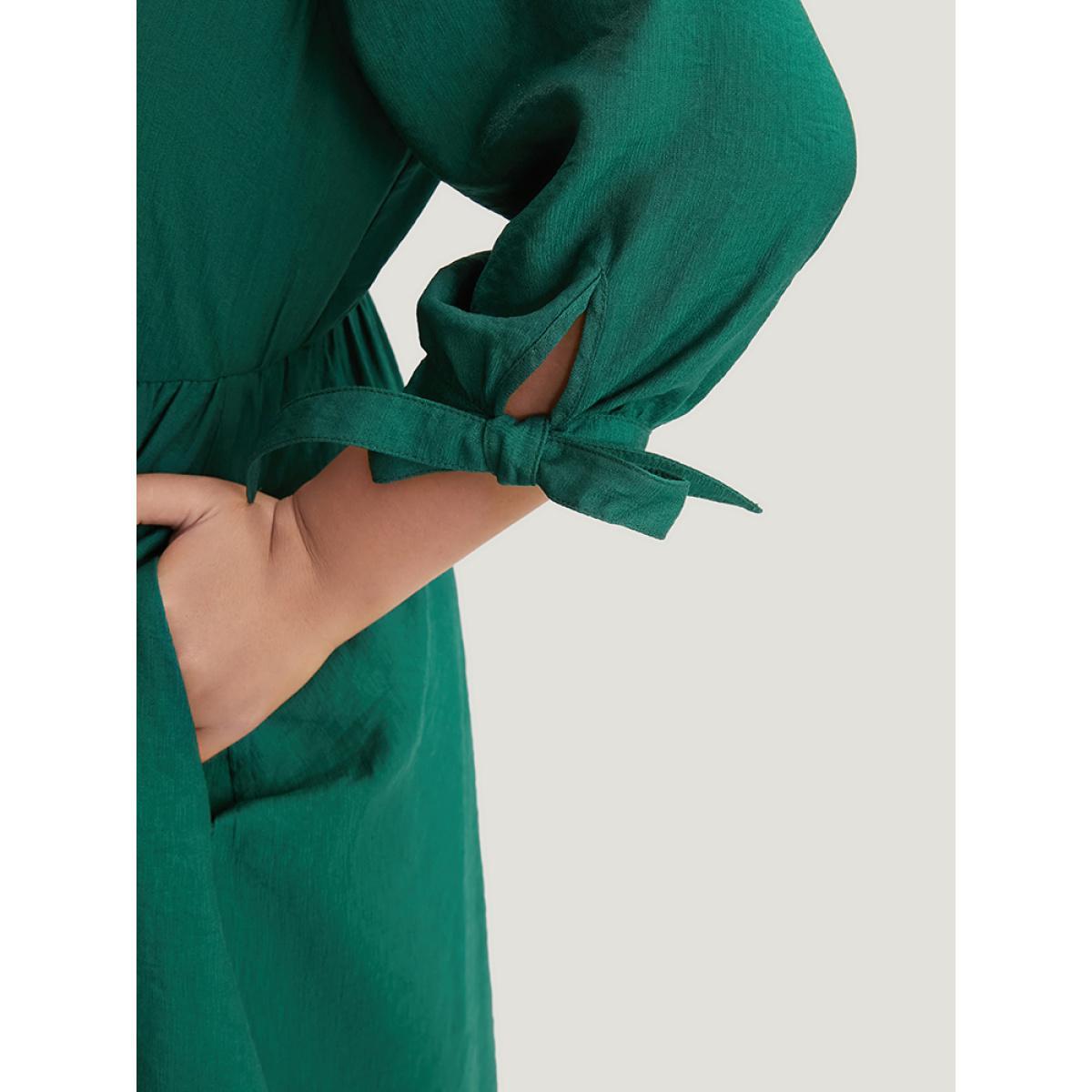 Plus Size Solid Pocket Knot Sleeve Half Zipper Arc Hem Dress DarkGreen Women Office Cross straps V-neck Elbow-length sleeve Curvy Midi Dress BloomChic 18-20/2X Product Image