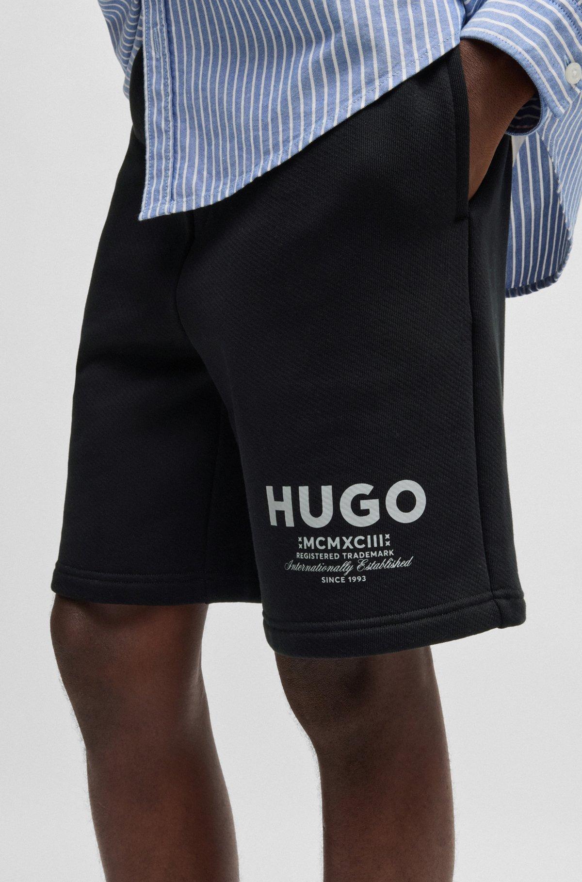 Loose-fit shorts in cotton terry with logo print Product Image