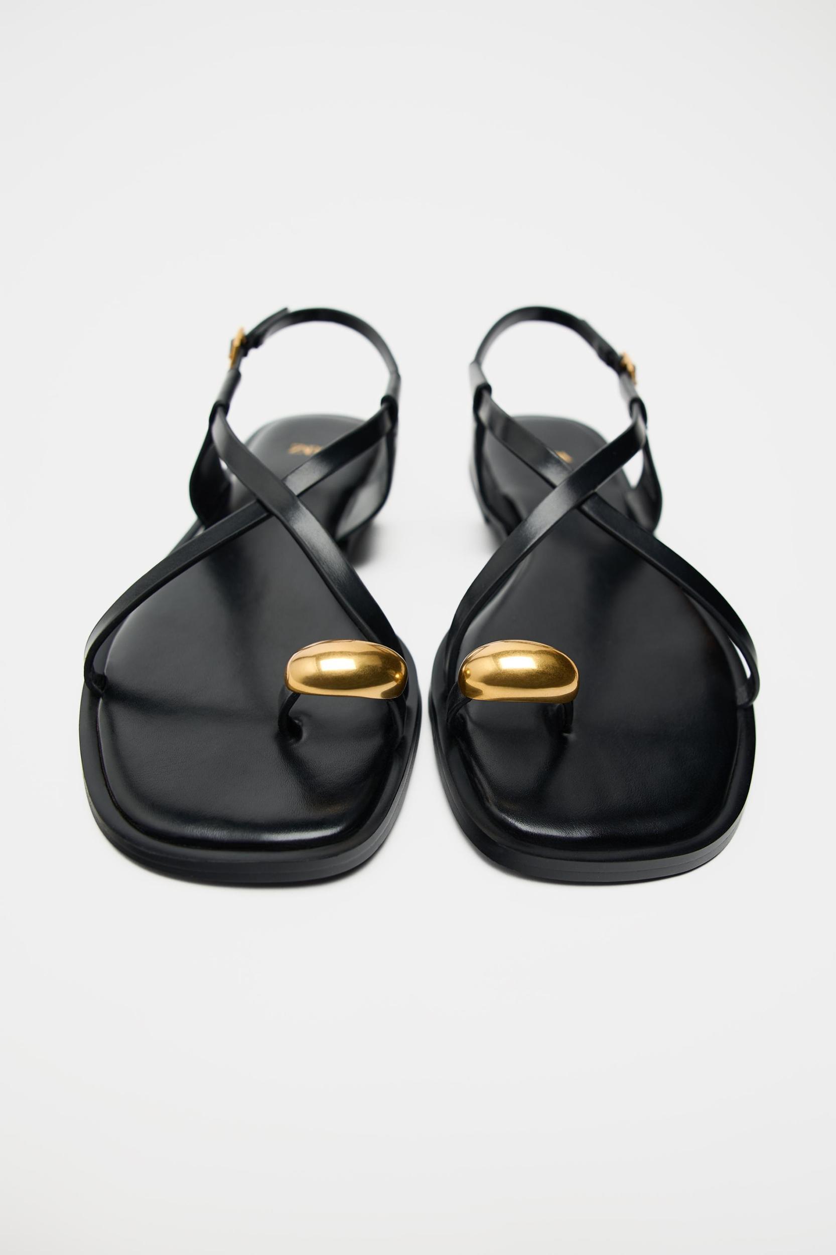 FLAT STRAPPY SANDALS WITH METAL ORNAMENT Product Image