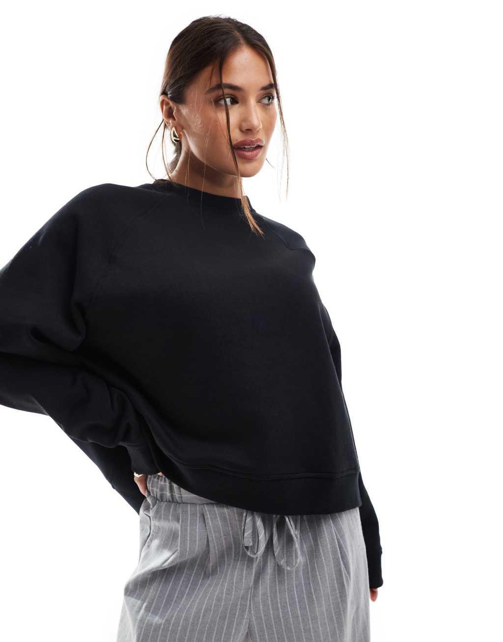 ASOS DESIGN oversized sweat with raglan detail in black Product Image