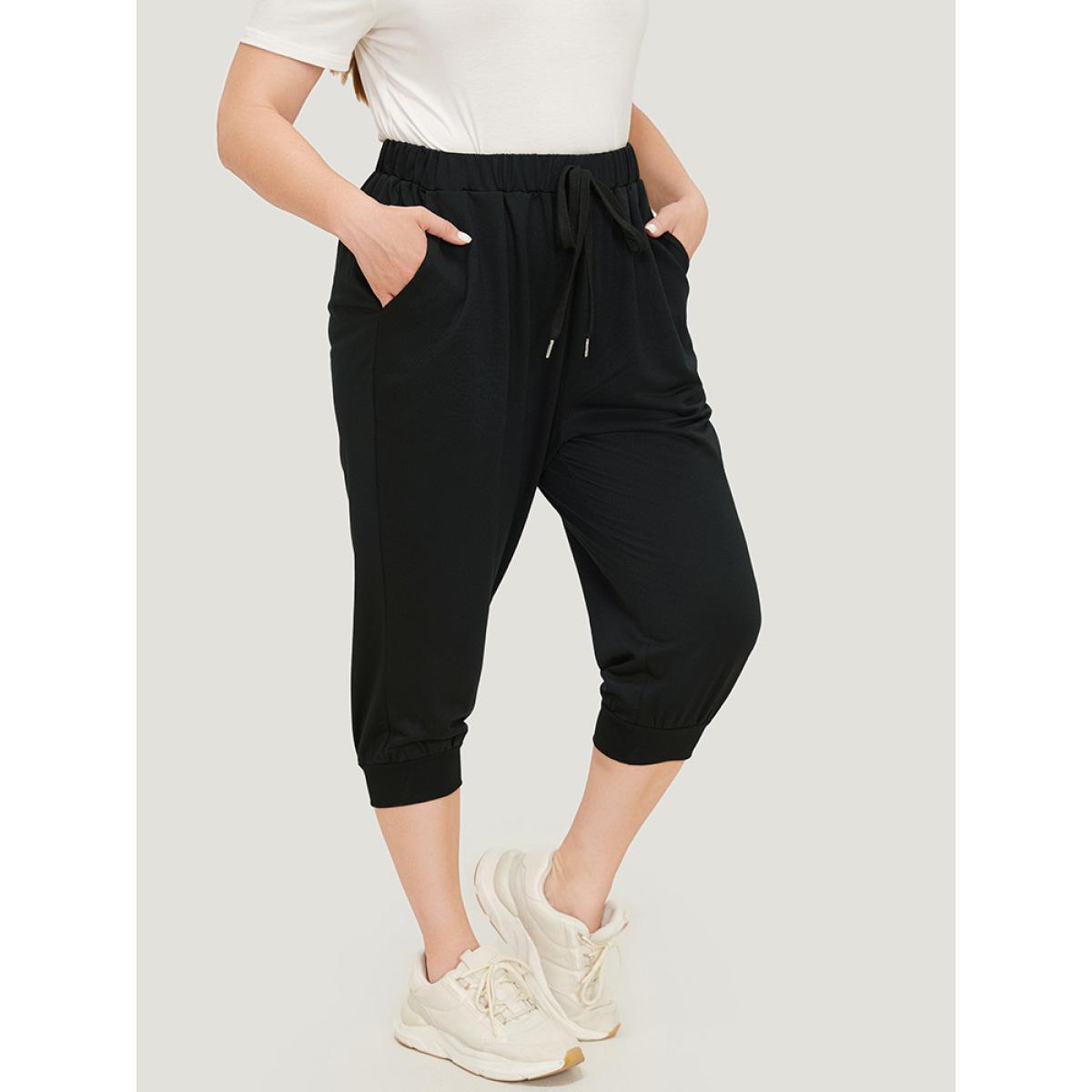 Plus Size Solid Knot Front Pocket Carrot Pants Women Black Casual High Rise Dailywear Pants BloomChic 10/M Product Image