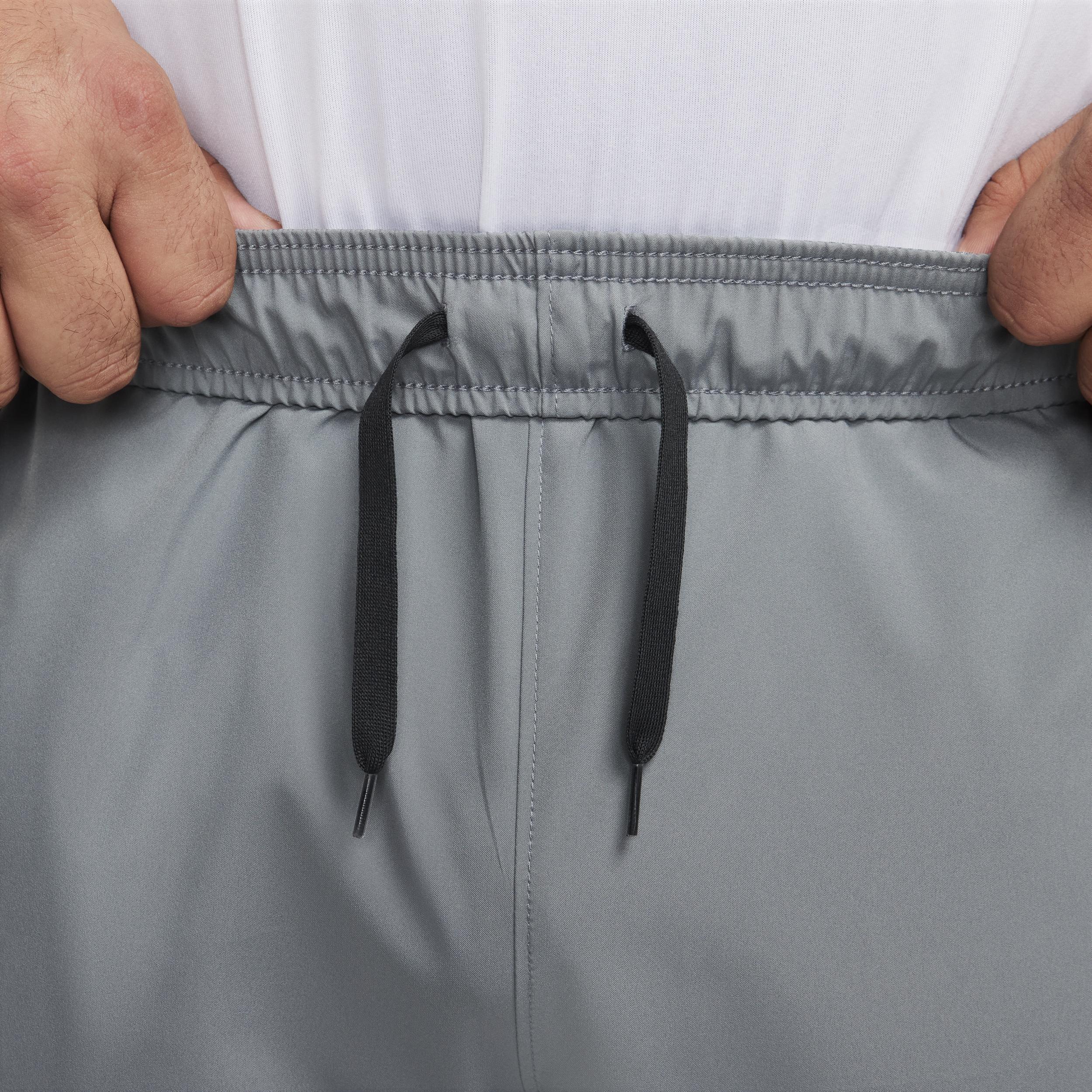 Nike Men's Form Dri-FIT Tapered Versatile Pants in Grey/Smoke Grey Size Large 100% Polyester Product Image