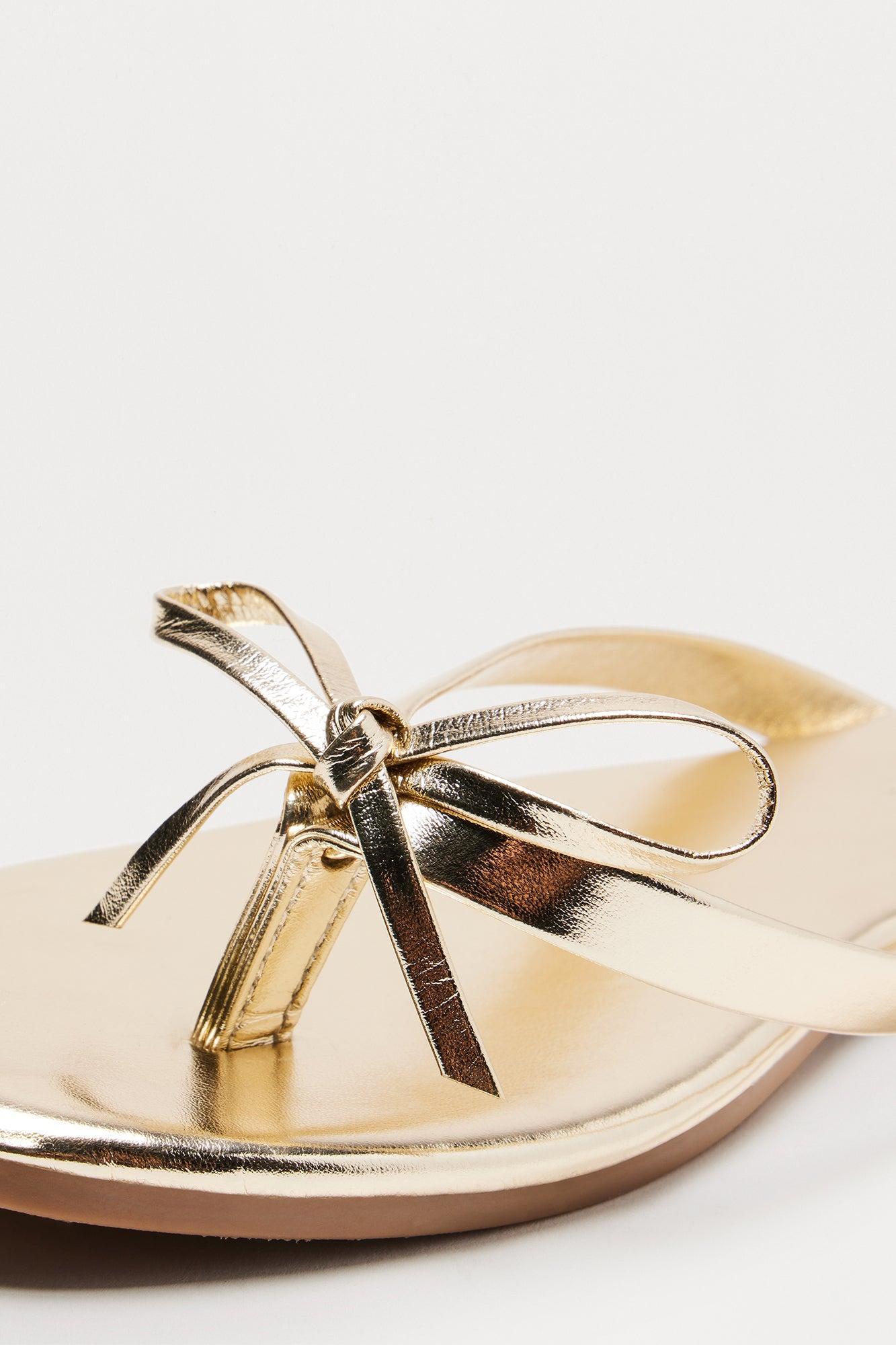 Coral Bow Flip Flops - Gold Product Image