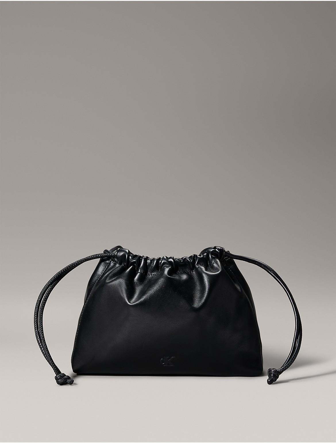 Calvin Klein Women's Monogram Logo Drawstring Crossbody Bag - White Product Image