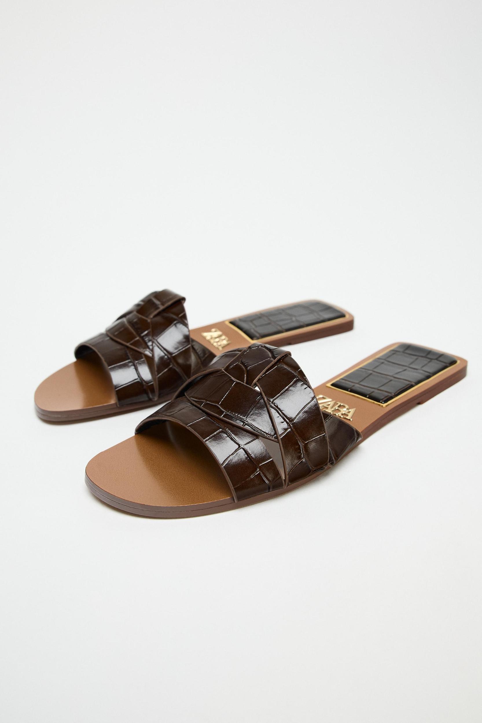 EMBOSSED LEATHER FLAT SANDALS Product Image