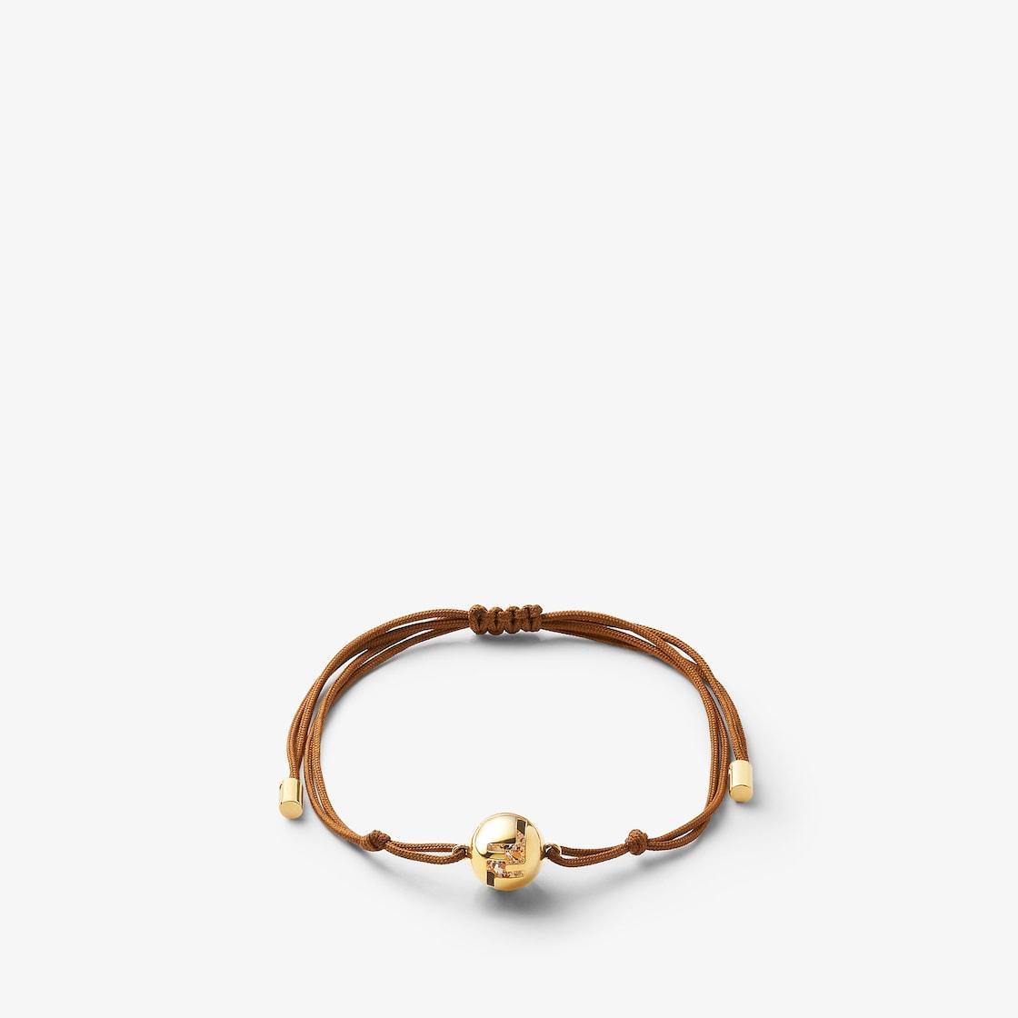 Fendi Sphera BraceletBrown cord and gold-colored metal bracelet Product Image