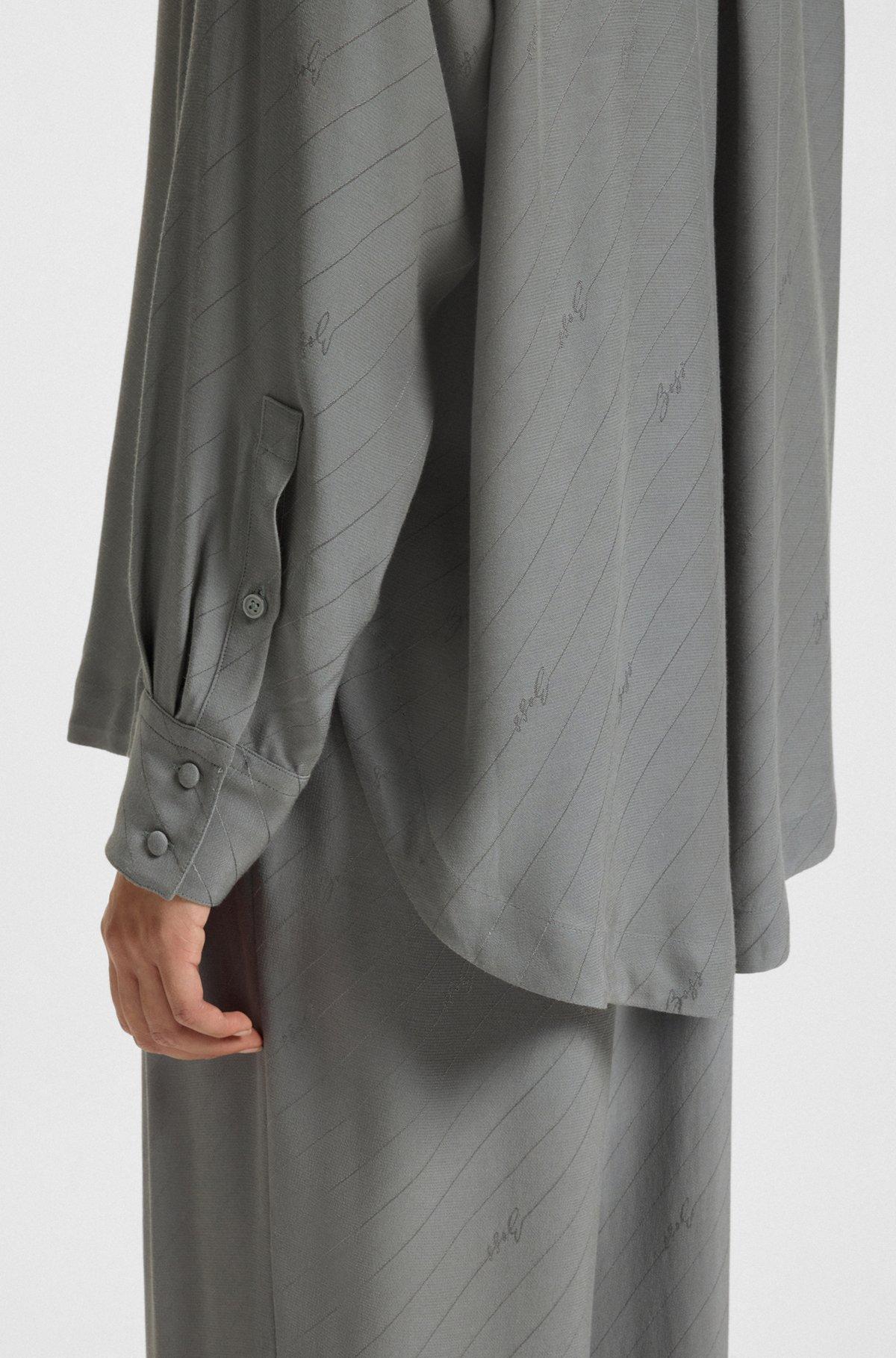 BOSS - Oversize-fit blouse with logos and fringing - Turquoise Product Image