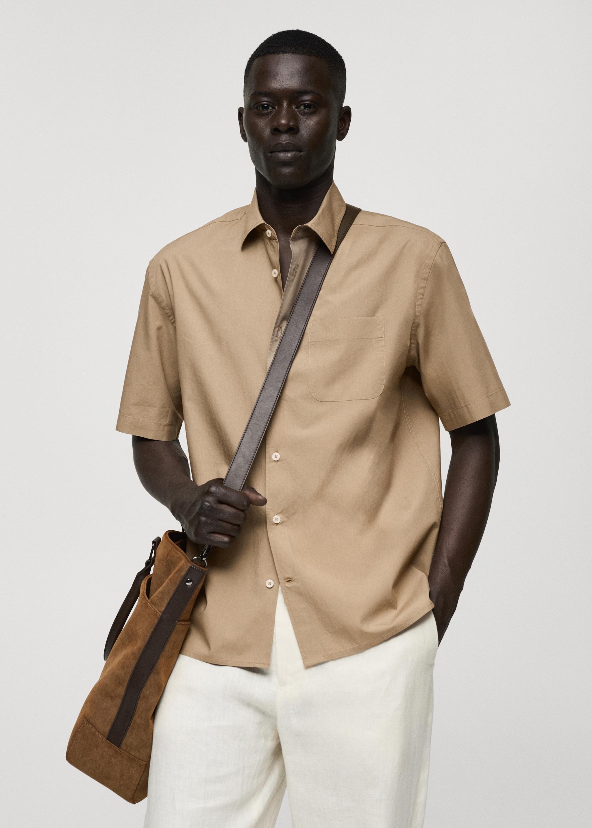 Tencel™™ cotton shirt with pocket - Men | MANGO USA Product Image