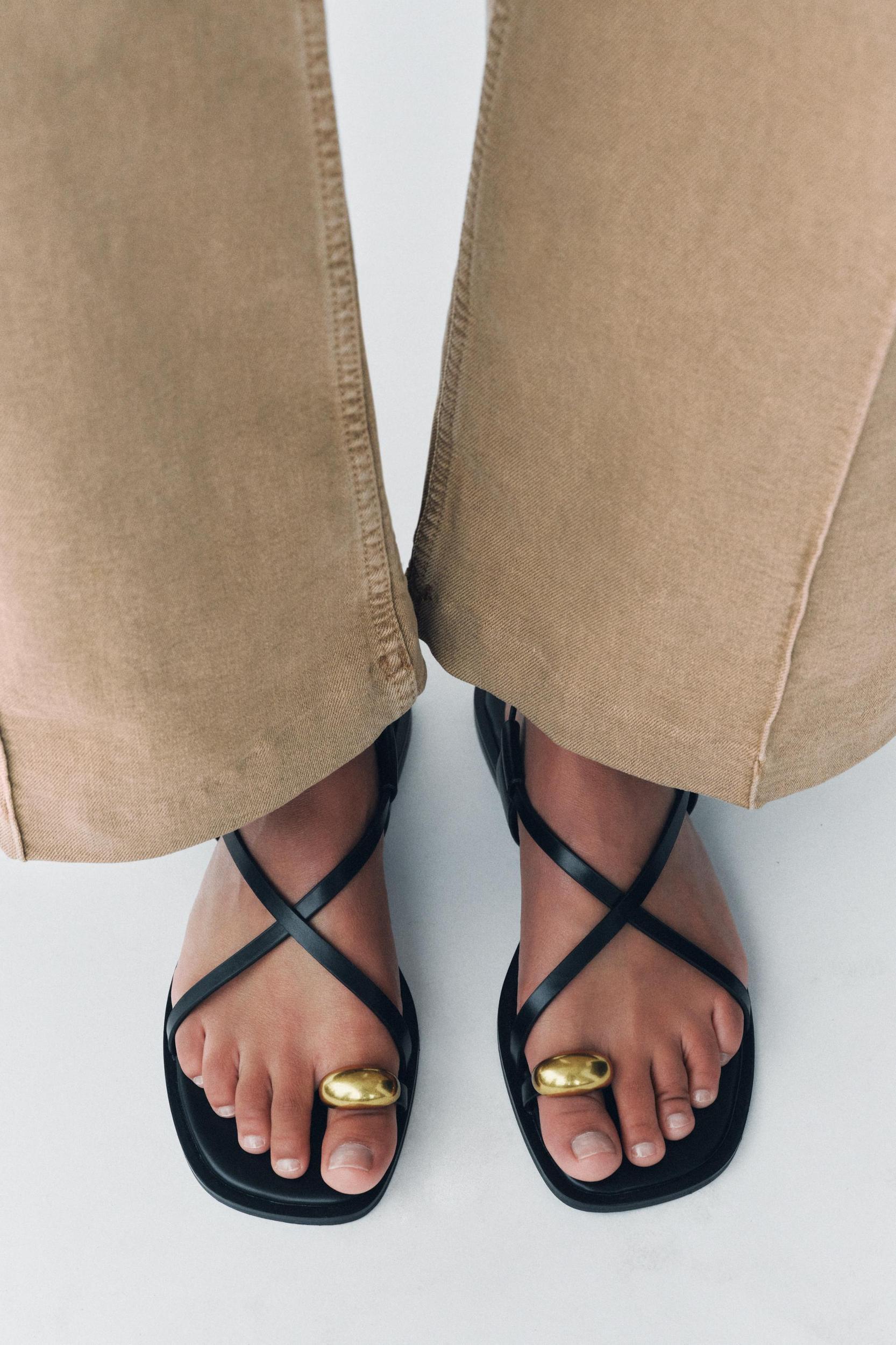 FLAT STRAPPY SANDALS WITH METAL ORNAMENT Product Image