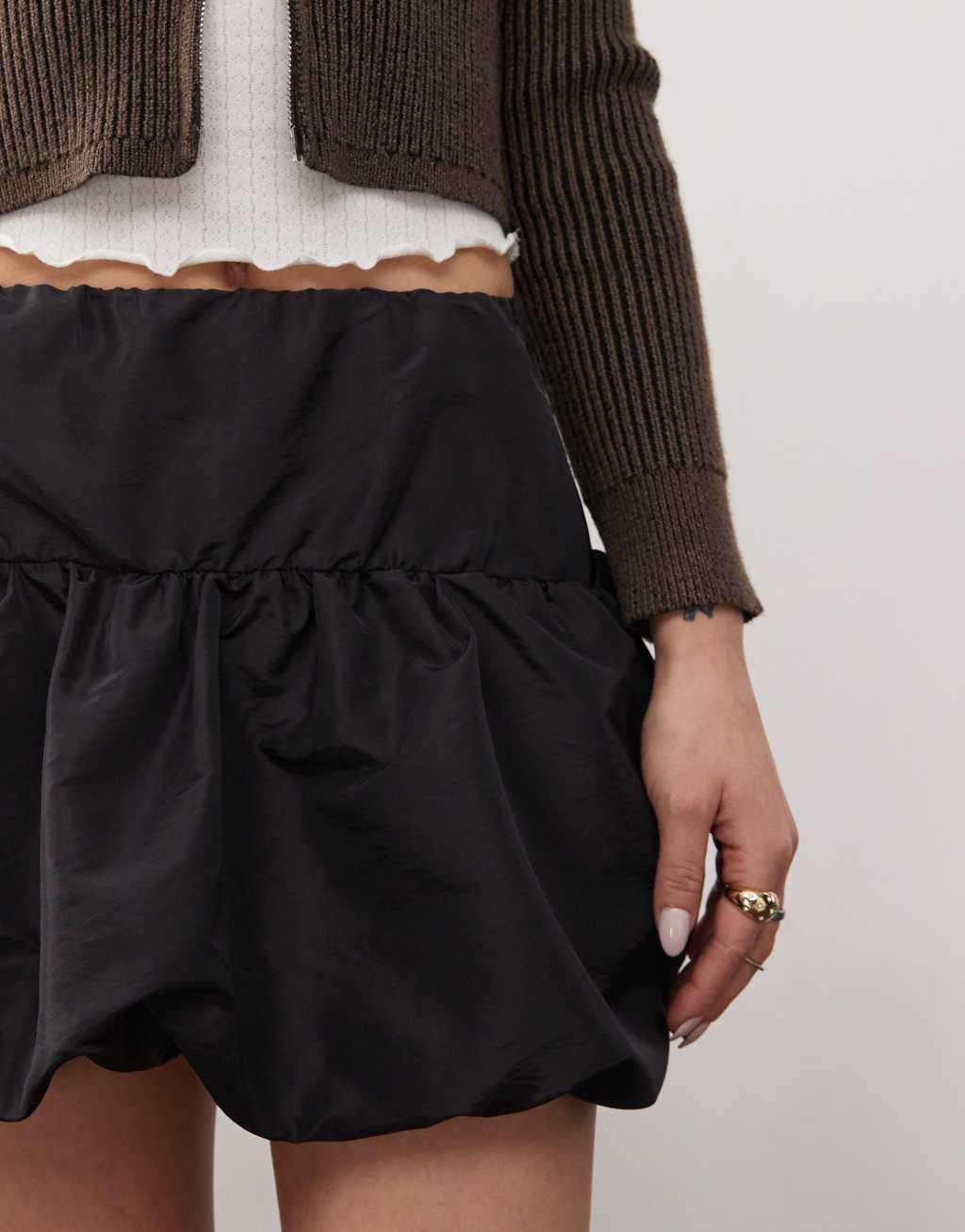 Reclaimed Vintage puffball mini skirt in taffeta in black  Product Image