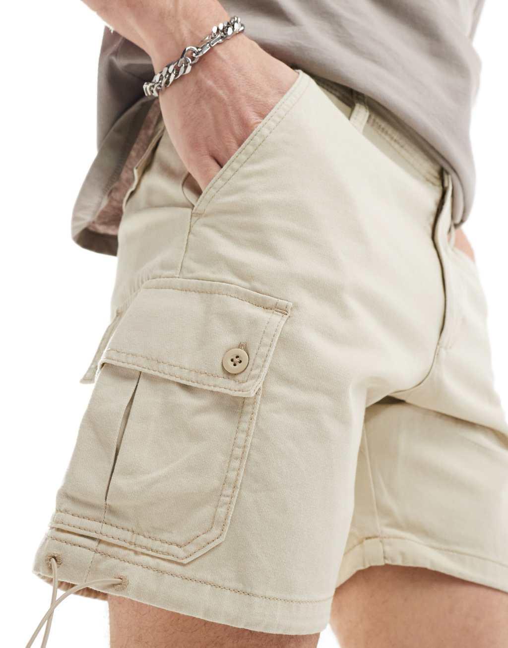 ASOS DESIGN slim cargo shorts in beige Product Image