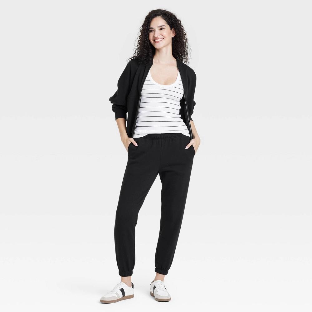 Women's Mid-Rise Essential Joggers - Universal Thread™ Black L: Cotton Blend, Side Pocket, Relaxed Leg, Knit Fleece Product Image