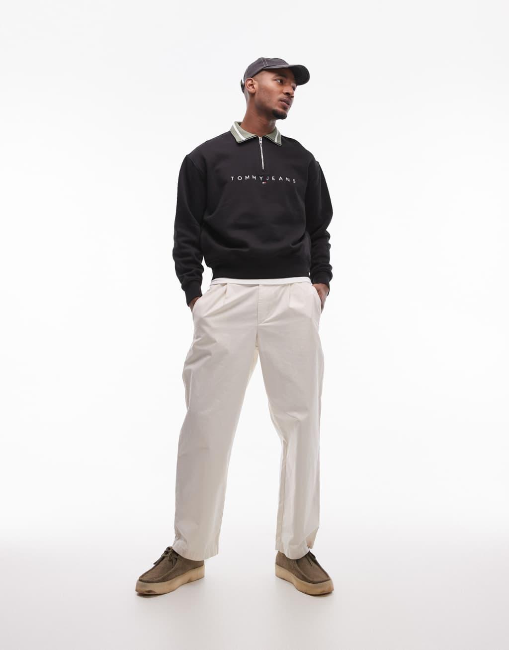 Tommy Jeans linear logo half zip sweatshirt in black Product Image