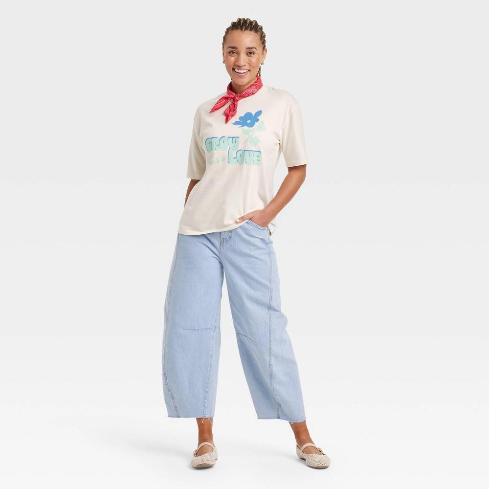 Women's Oversized Short Sleeve Knit Graphic T-Shirt - Universal Thread™ Cream S: 100% Cotton, Midweight Knit Jersey, Crew Neck Pullover Product Image