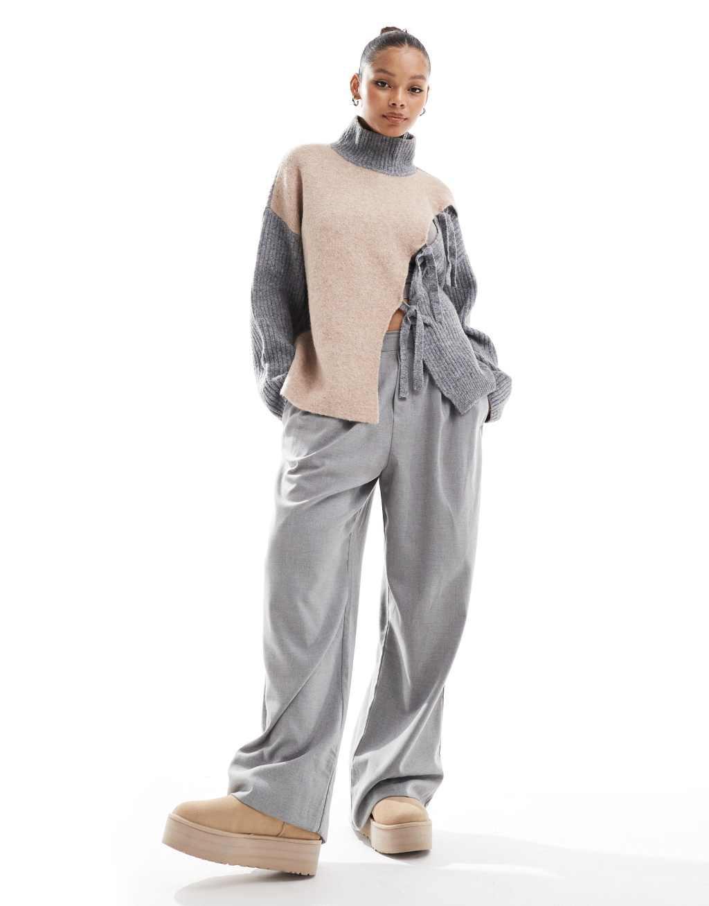 ASOS DESIGN high neck sweater with tie detail and color block in neutral Product Image