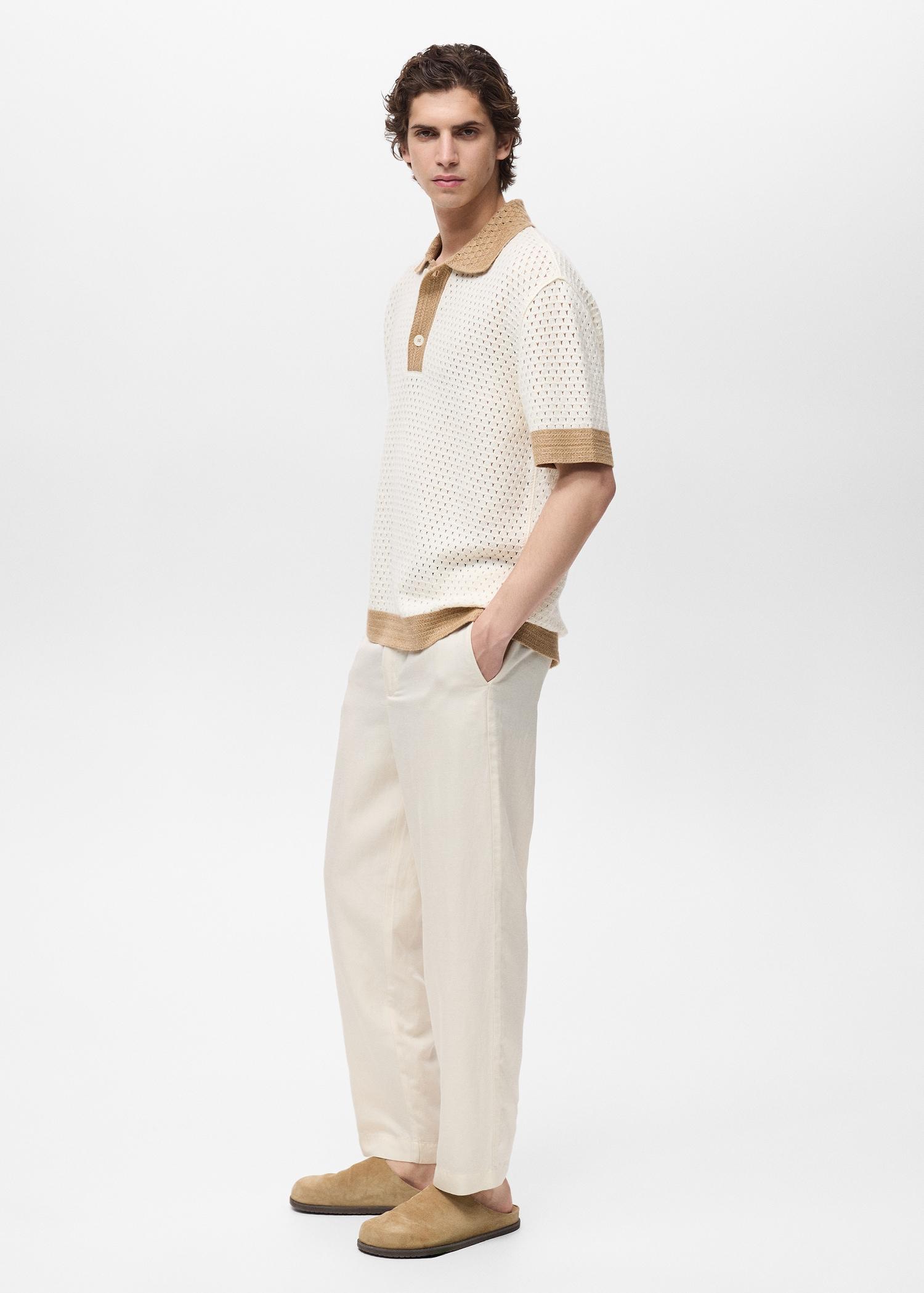 Openwork knitted polo shirt with contrasting details - Men | MANGO USA Product Image