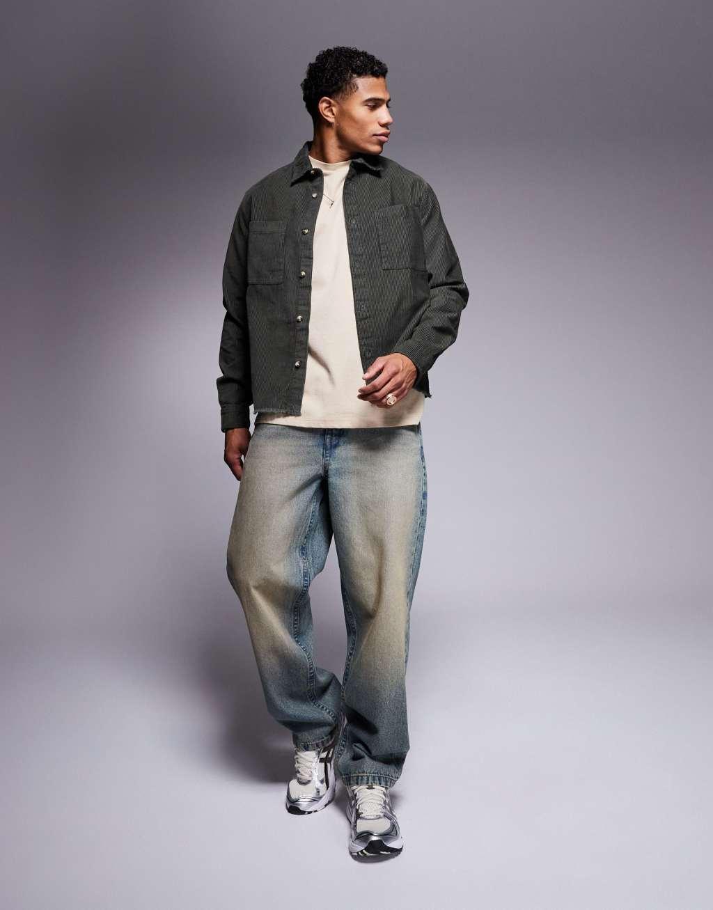 ASOS DESIGN relaxed cord shirt with raw hem and back embroidery in green Product Image