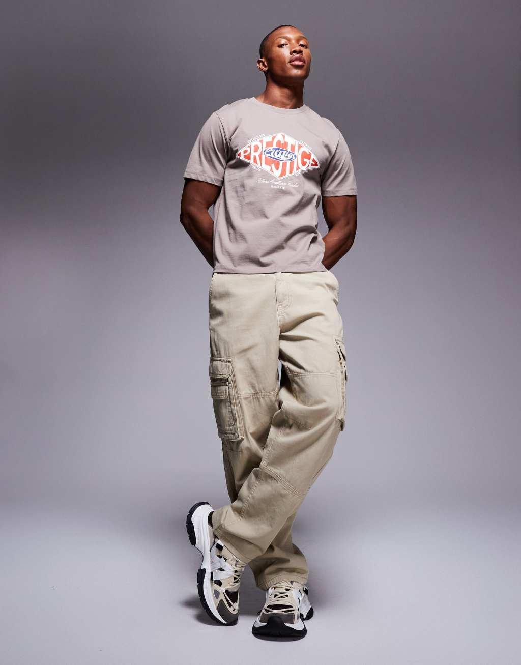 ASOS DESIGN boxy t-shirt in brown with street chest print Product Image
