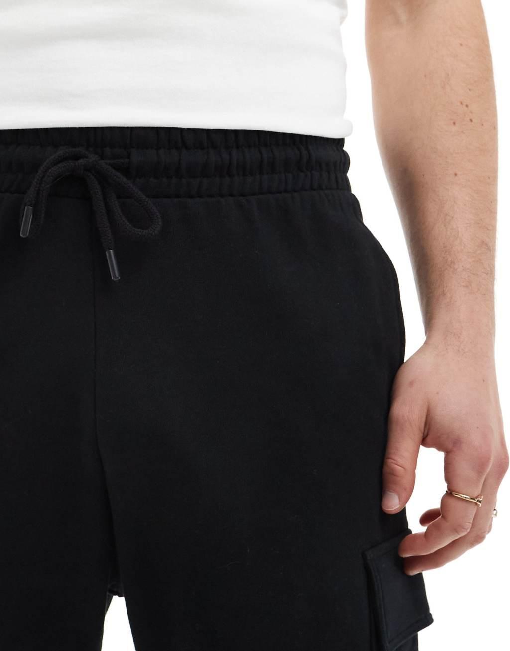 ASOS DESIGN slim shorts with cargo pocket in black Product Image