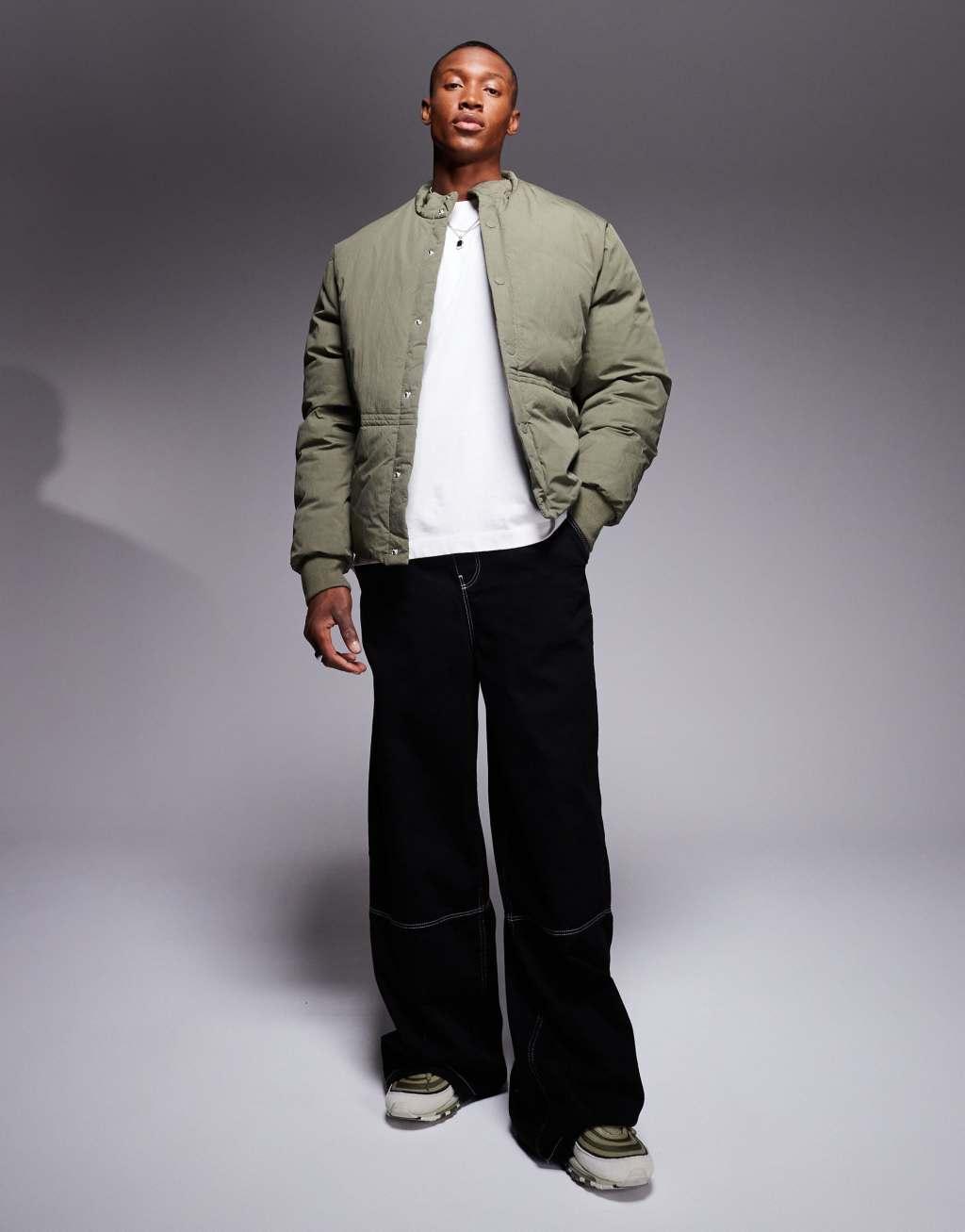 ASOS DESIGN puffer jacket with concealed pockets and rib cuffs in green Product Image