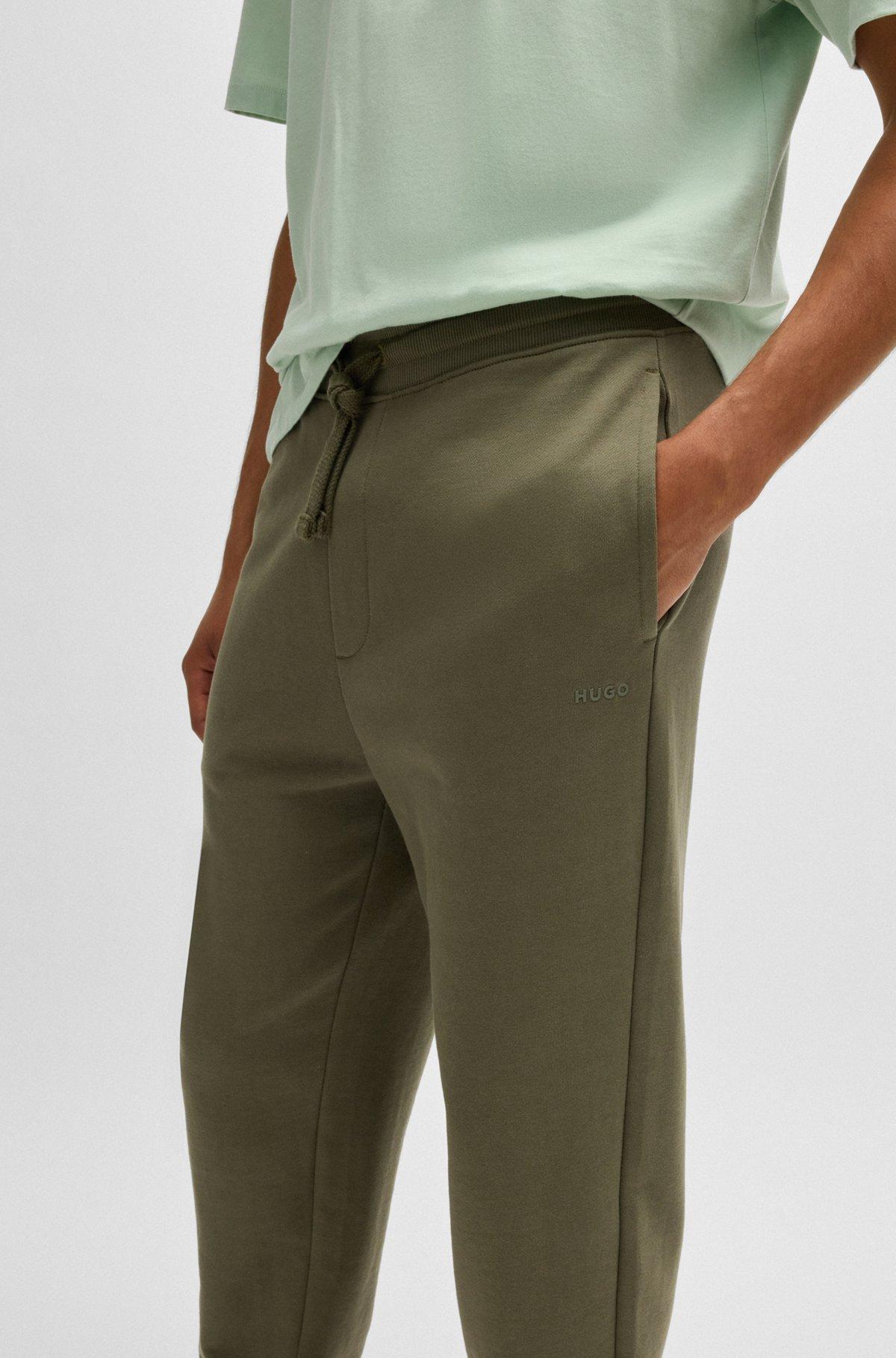 Cotton-terry tracksuit bottoms with logo print Product Image