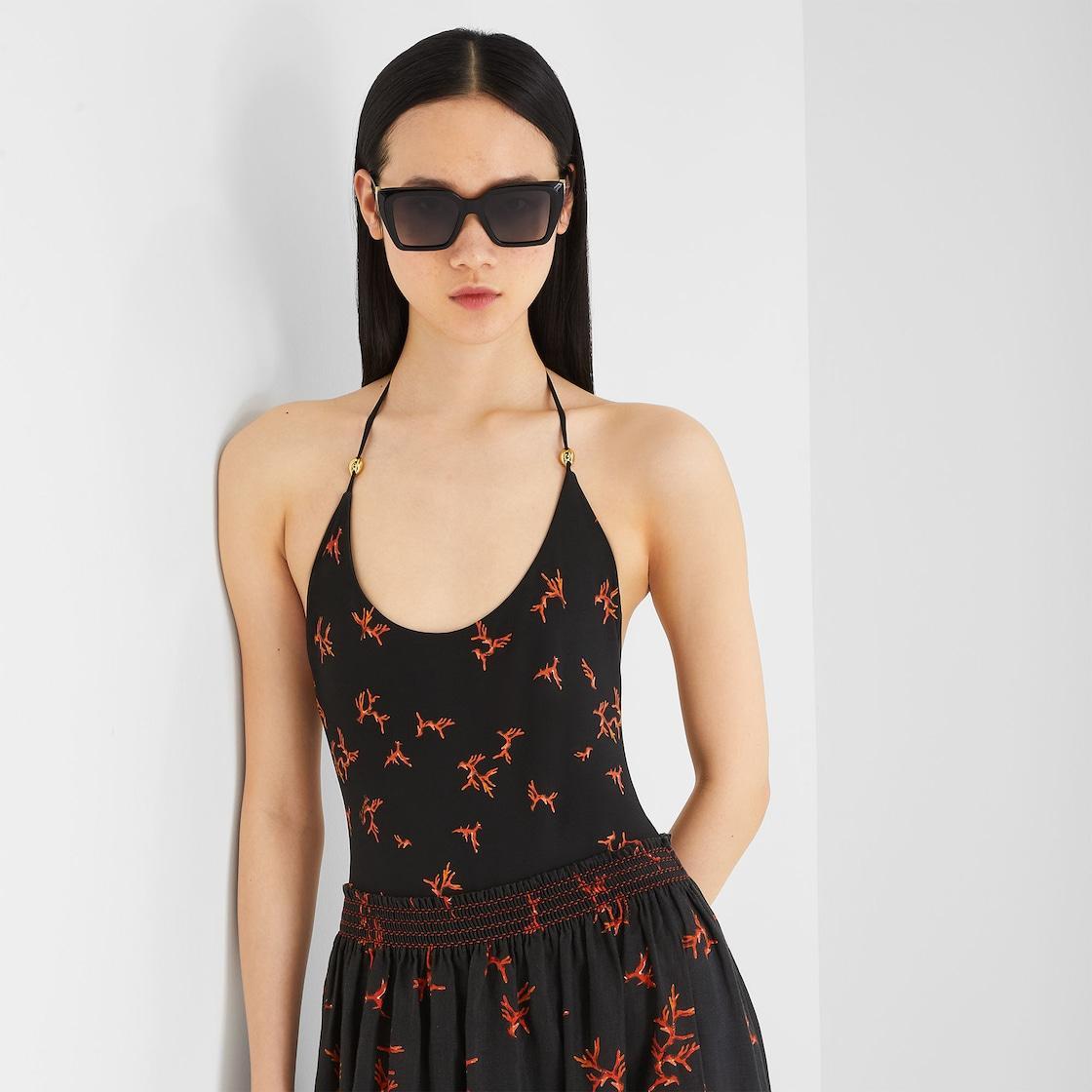 SwimsuitBlack Lycra® one-piece swimsuit with coral print Product Image