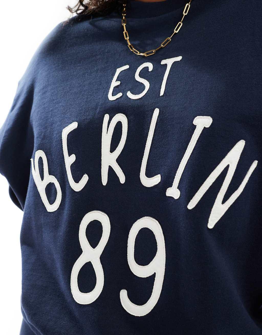 ASOS DESIGN sweat with applique berlin graphic in navy - part of a set Product Image