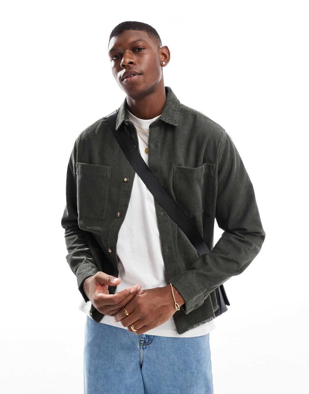 ASOS DESIGN relaxed cord shirt with raw hem and back embroidery in green Product Image